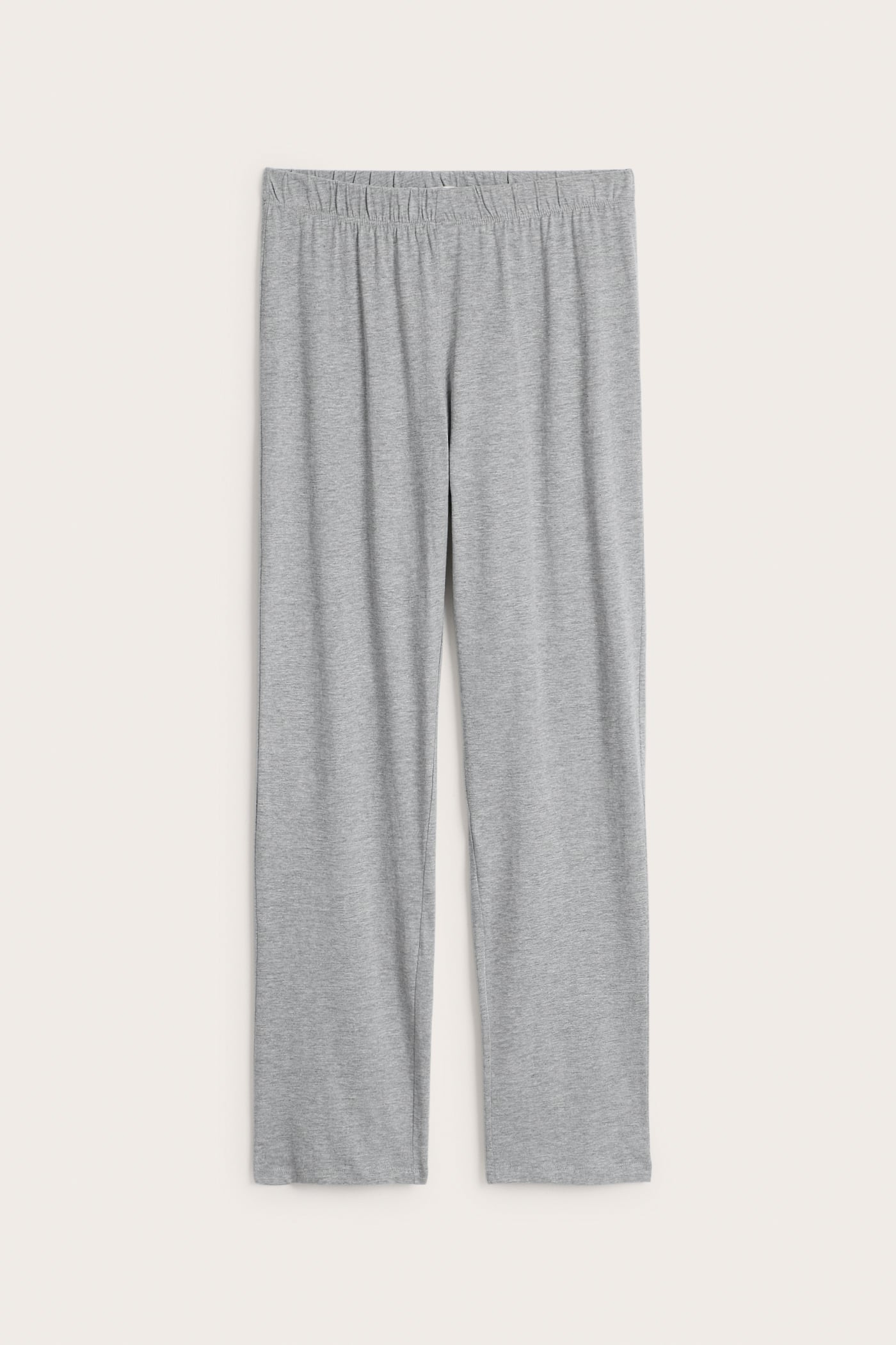 Frontvy av herrarnas ljusgrå melerade pyjamasbyxor i jersey med dold resår i midjan.