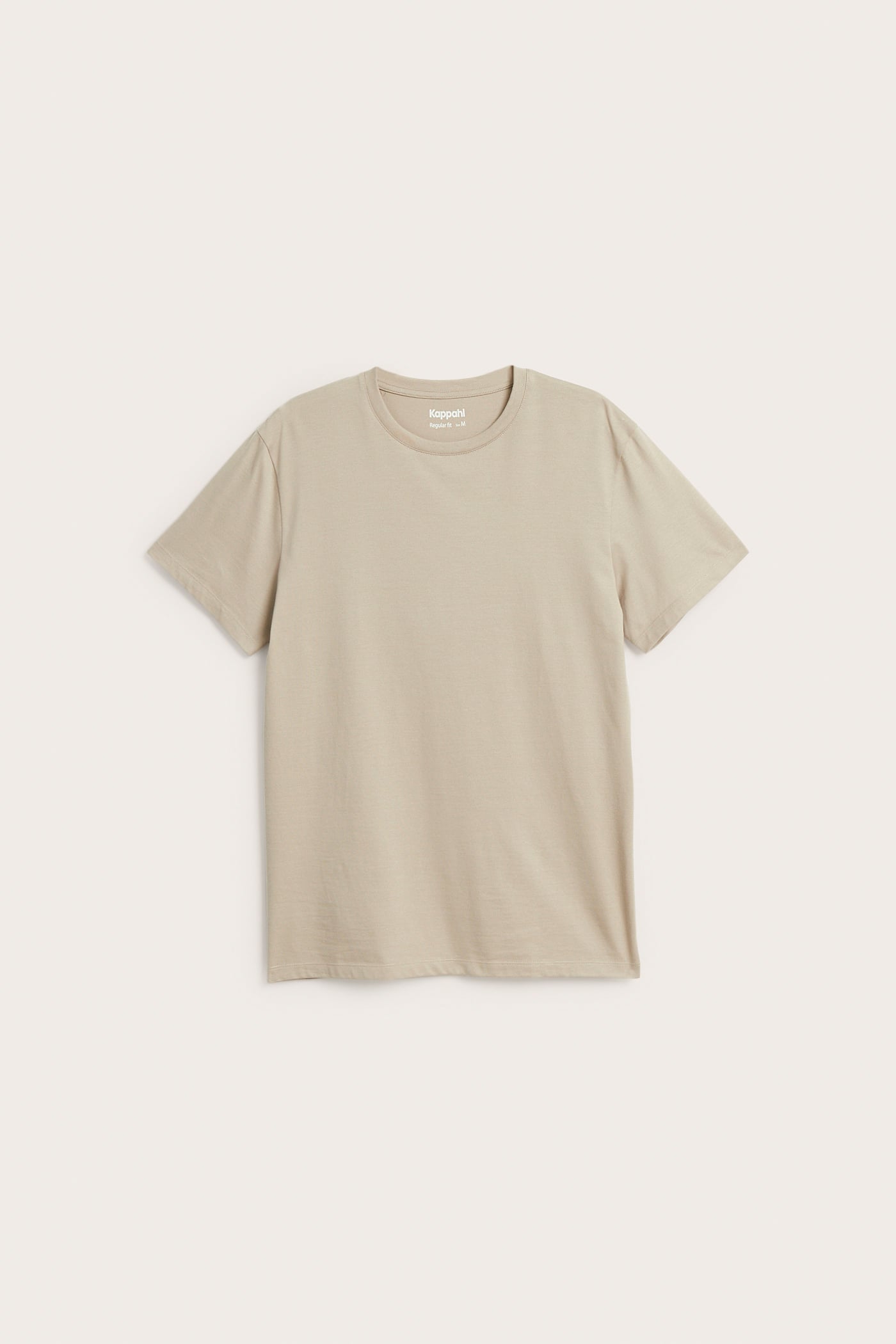 Framifrån, en beige kortärmad enfärgad t-shirt.