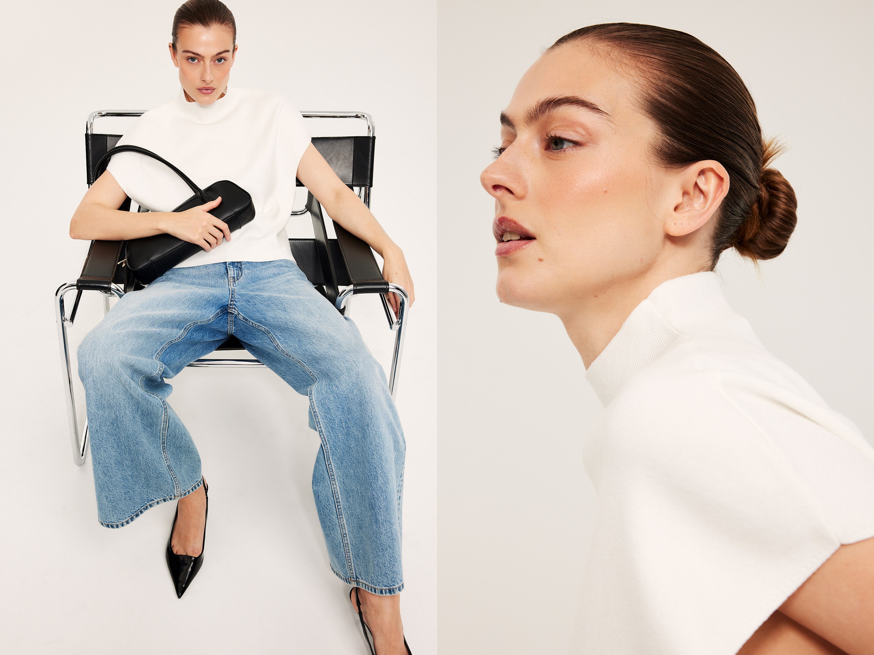 En kvinne i hvit topp og lyse jeans, med en svart veske.