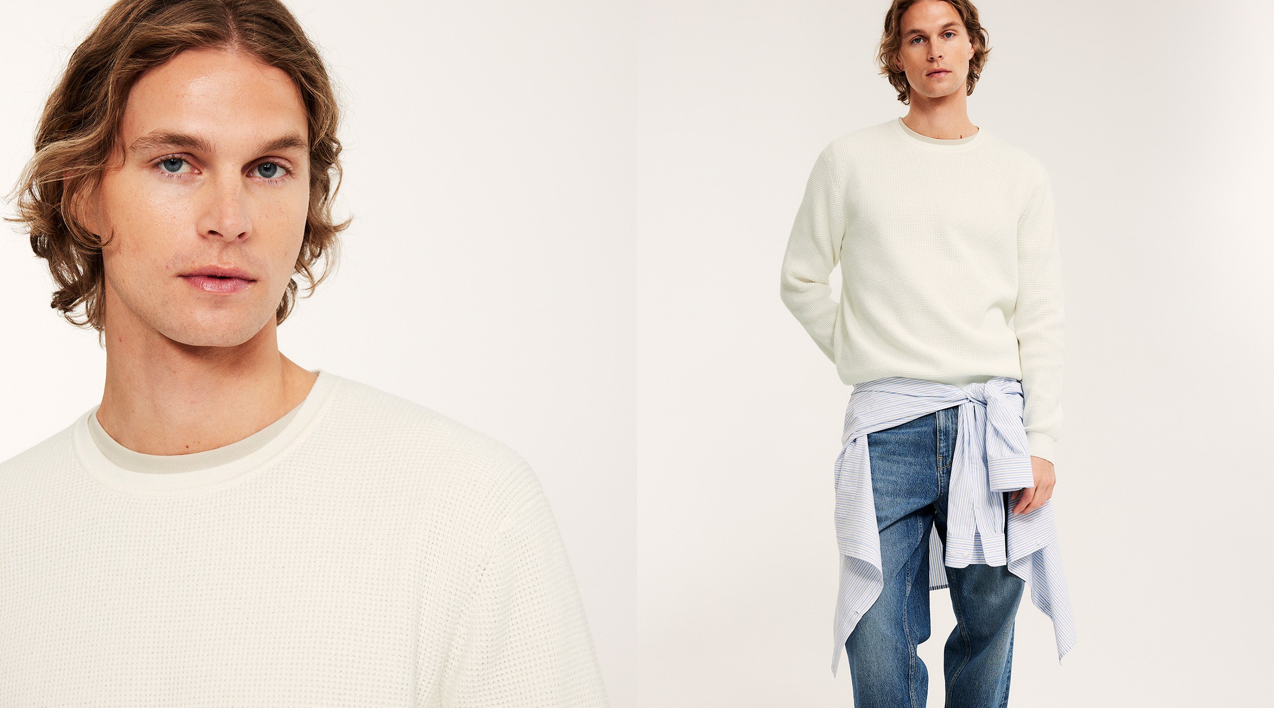 Mies, jolla on valkoinen neulepusero, farkut ja solmittu sininen paita vyötäröllä.