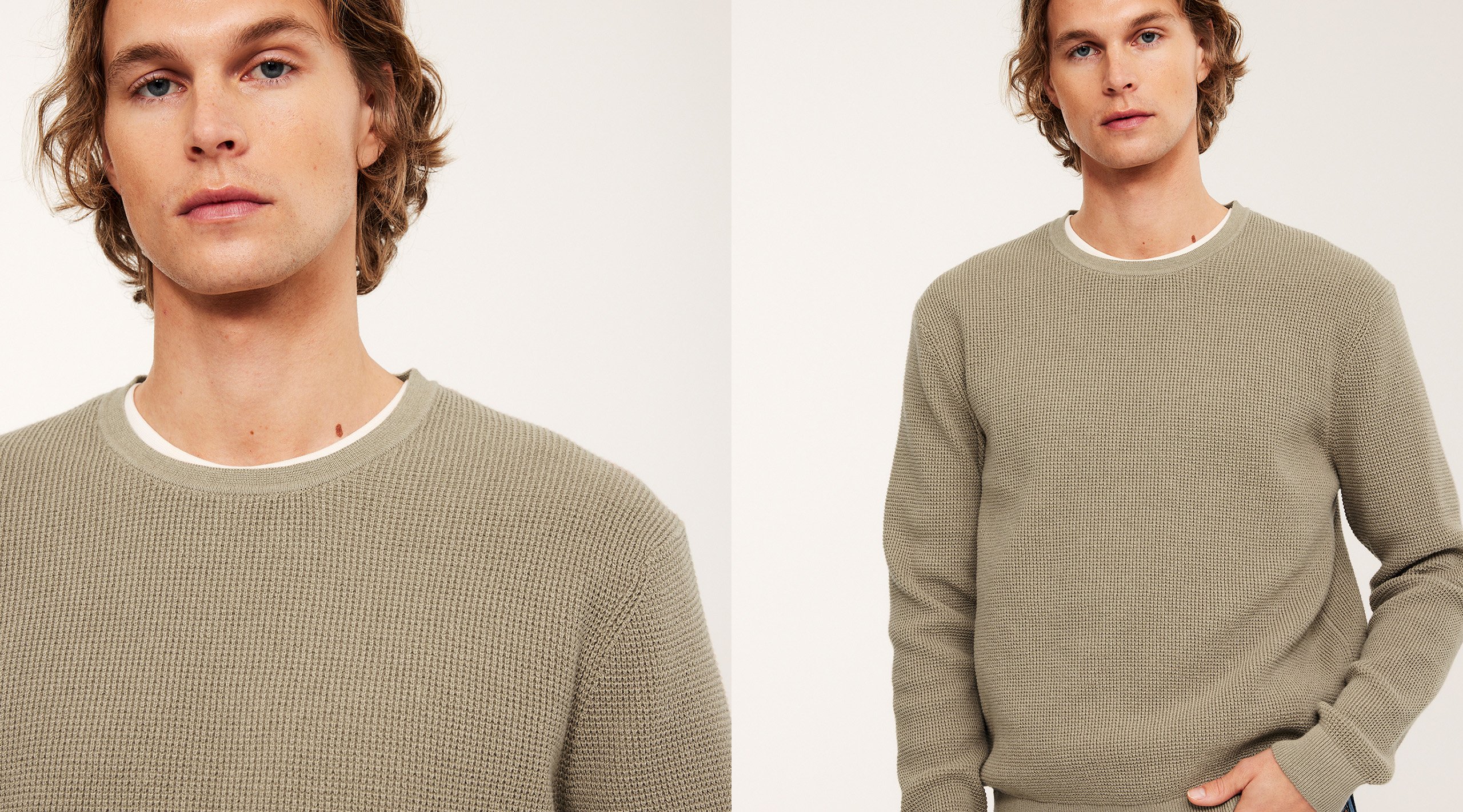Mężczyzna w beżowym swetrze z białą koszulką pod spodem.