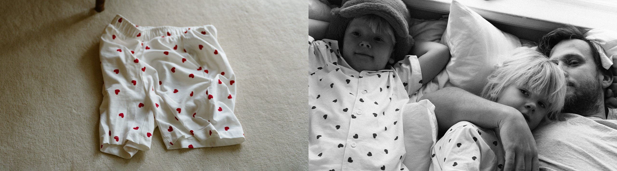 En far og to barn i matchende pysjamas med hjerter på.
