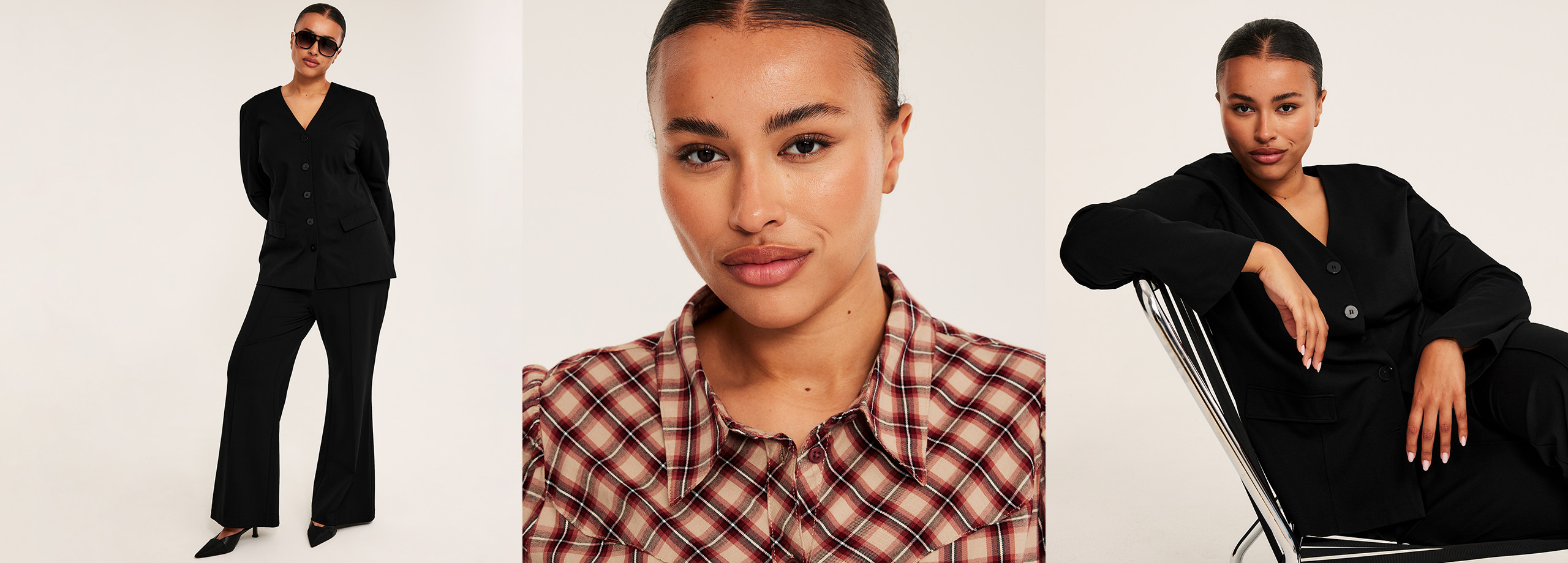Plus size -naistenvaatteet – nainen mustassa pukussa. 