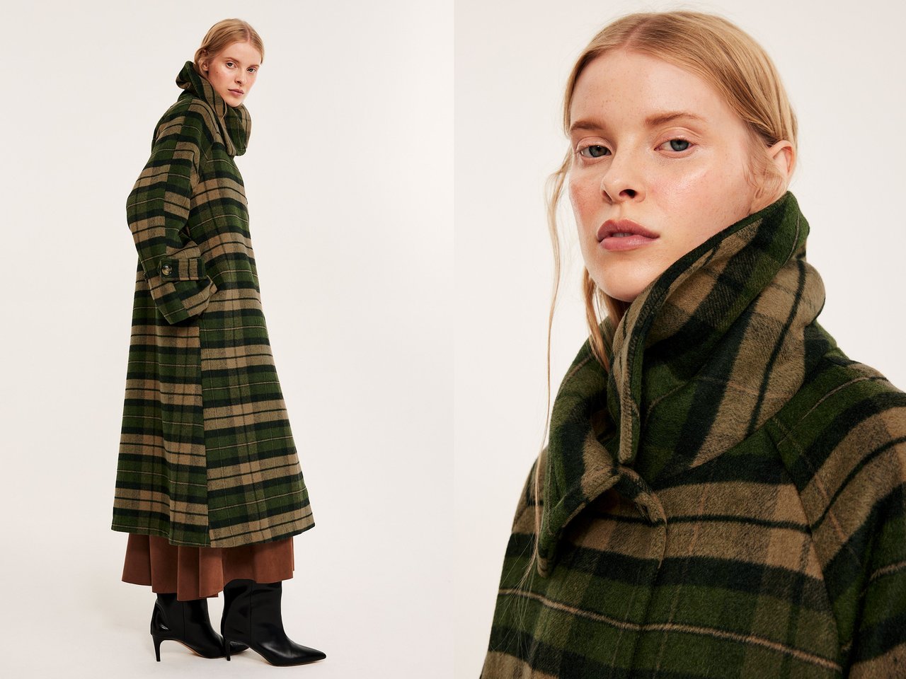 Kvinna i en lång mörkgrön och rutig kappa