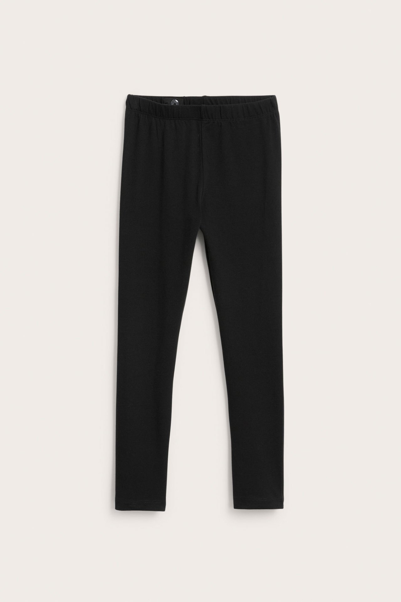 Edestäpäin mustat lasten leggingsit, normaali istuvuus ja joustava vyötärö.