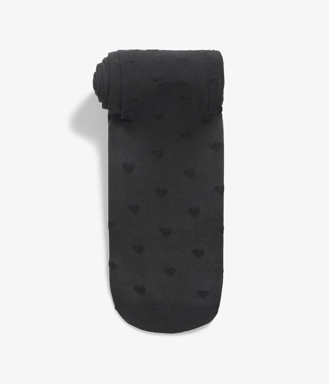 Widok z góry na czarne rajstopy 20 den z wzorem serc na całej powierzchni, złożone.