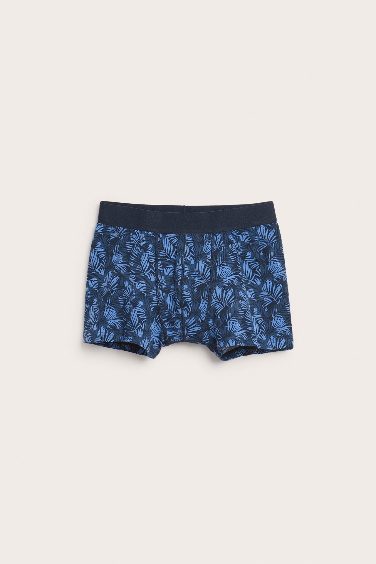 Edestä miesten siniset jersey-bokserit, vaaleansinisellä lehtikuviolla ja tummalla kuminauhavyötäröllä.