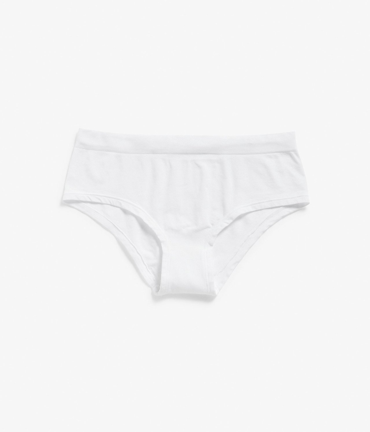 Edestä näkymä valkoisista saumattomista hipster-alushousuista, joissa on ribattu haaraosa.