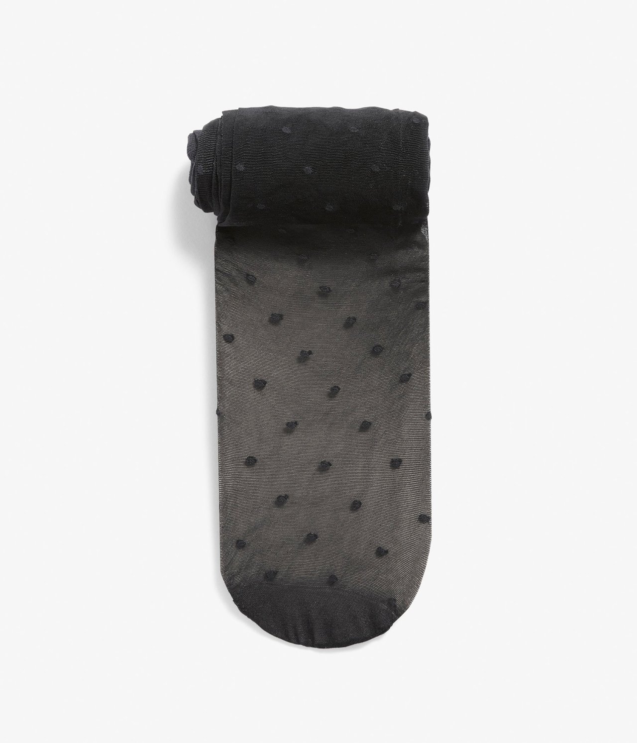 Widok z góry na złożone czarne, przezroczyste rajstopy w drobne kropki.