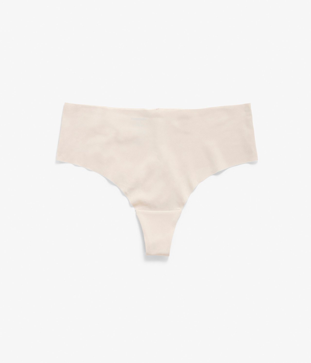 Frontvisning av en beige, sømløs stringtruse med rent snitt og midi-høy midje.