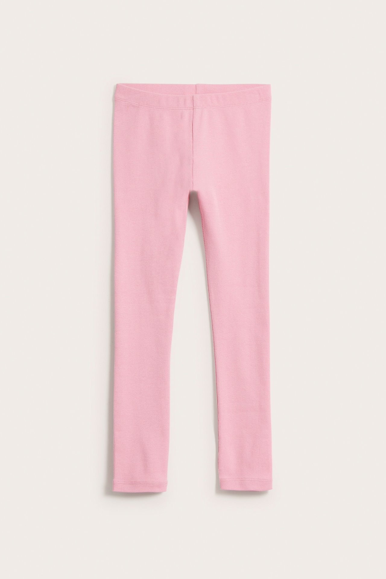 Framifrån, rosa ribbade leggings i bomullsblandning för barn.