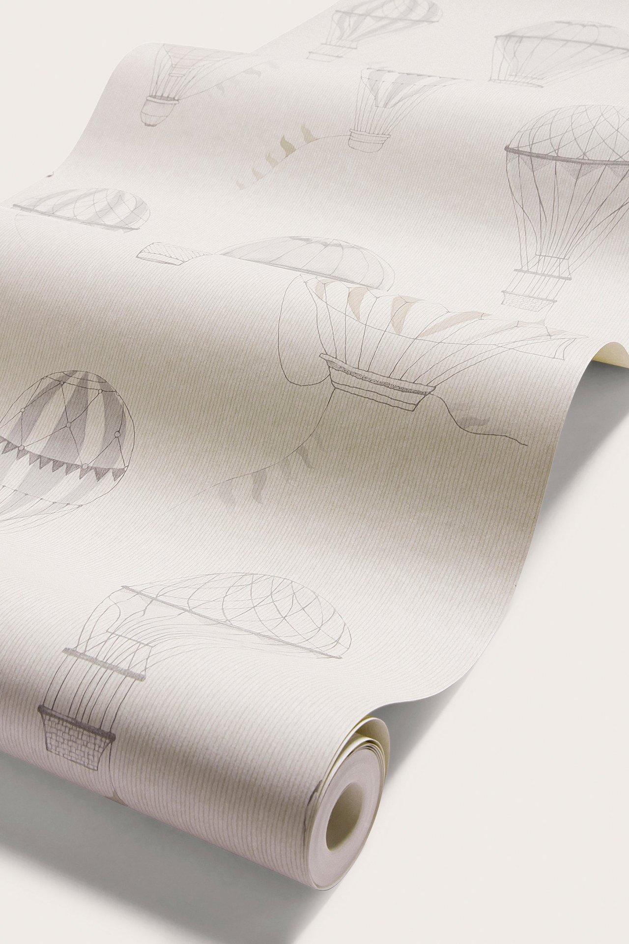 Zbliżenie beżowej tapety flizelinowej w szaro-beżowe balony, z cienkimi jasnoszarymi liniami.