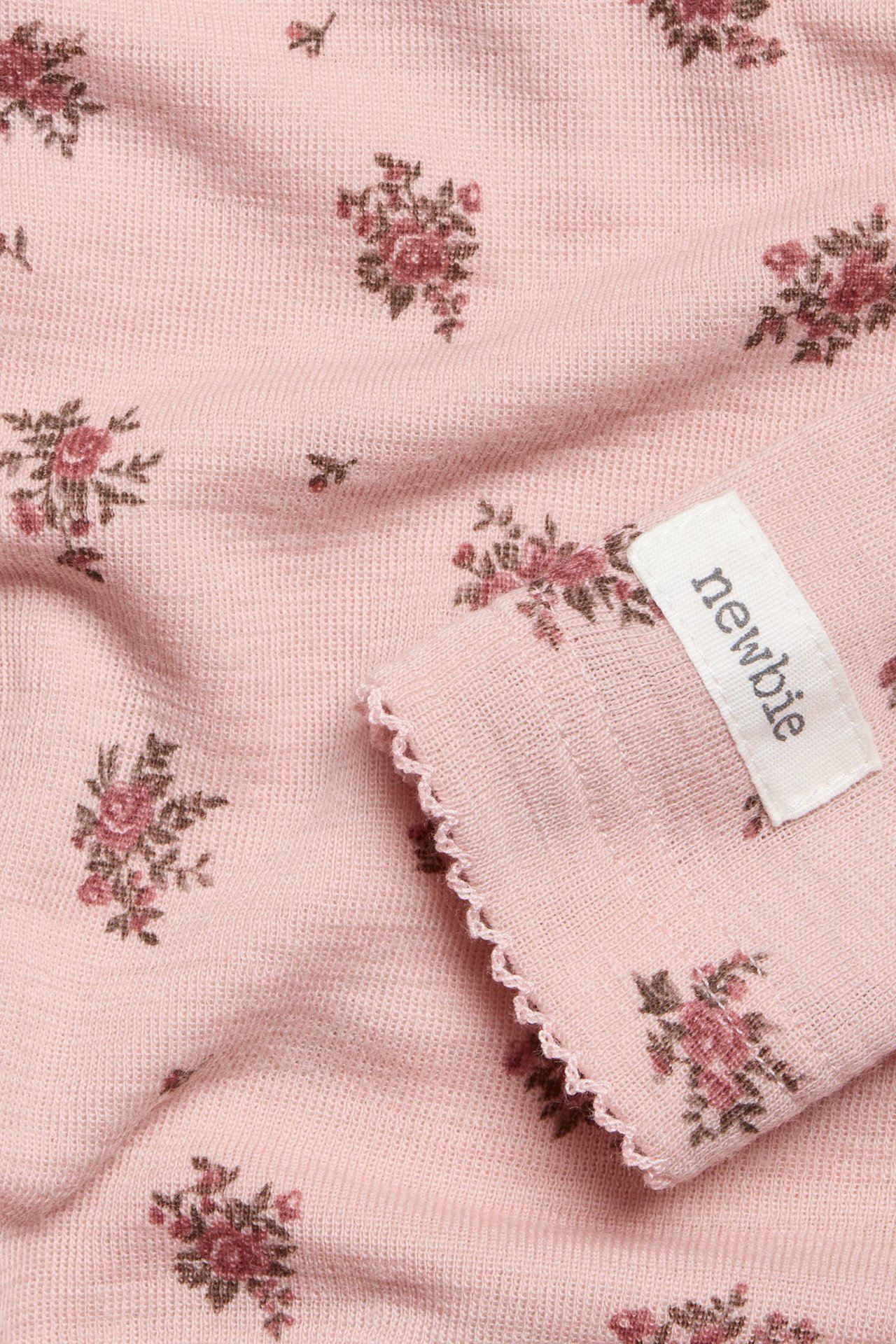 Blommig body i merinoull baby - Rosa - 1