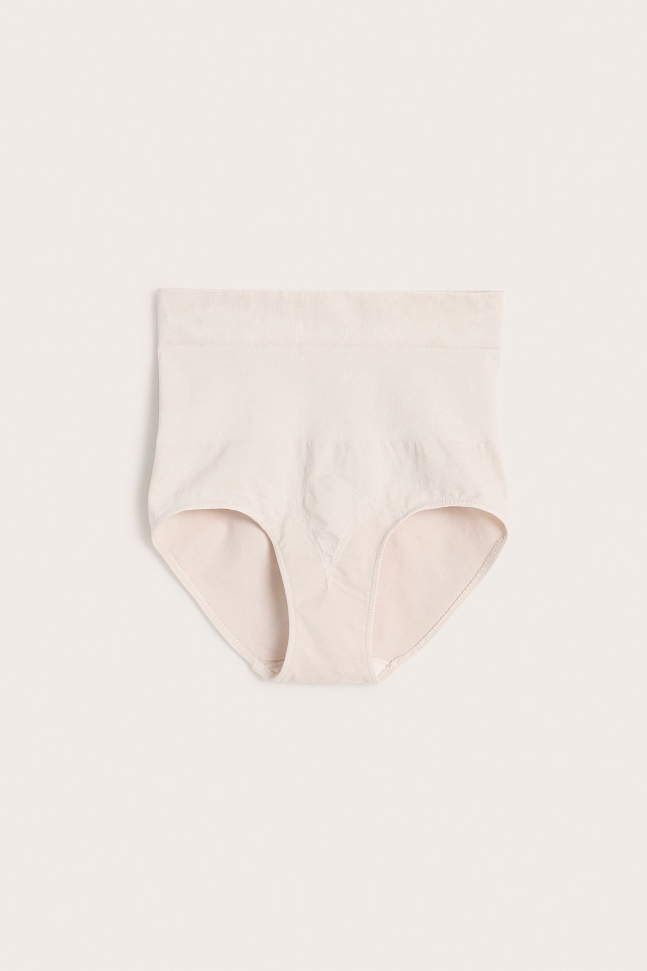 Frontvisning: Lys beige sømløs shapingtruse med høy midje for kvinner, i ensfarget polyamid.