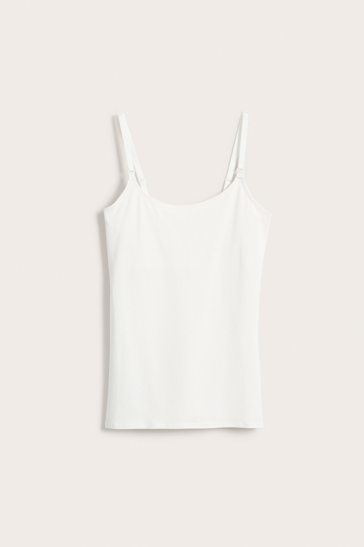 Biały bawełniany top do karmienia z regulowanymi ramiączkami i wsparciem biustu, widok z przodu.