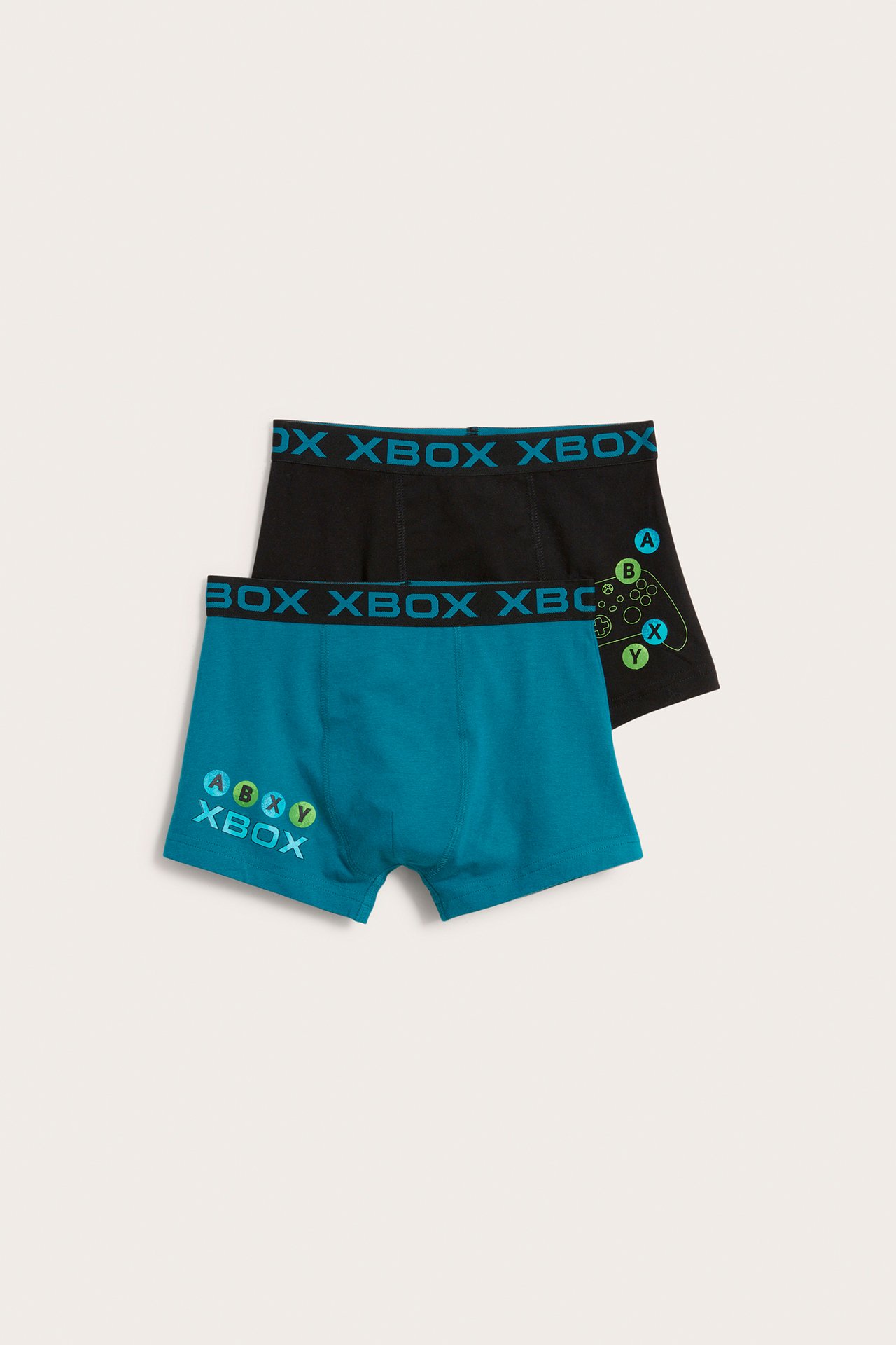 Widok z przodu: dziecięce turkusowe i czarne bokserki z nadrukiem Xbox, oba z logo w pasie.