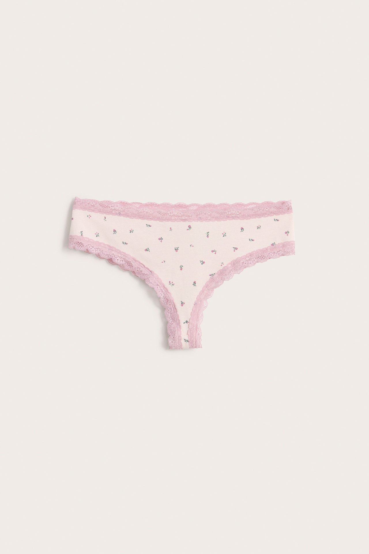 Forfra, lyserosa mønstret cheeky truse for dame med rosa blondekant.