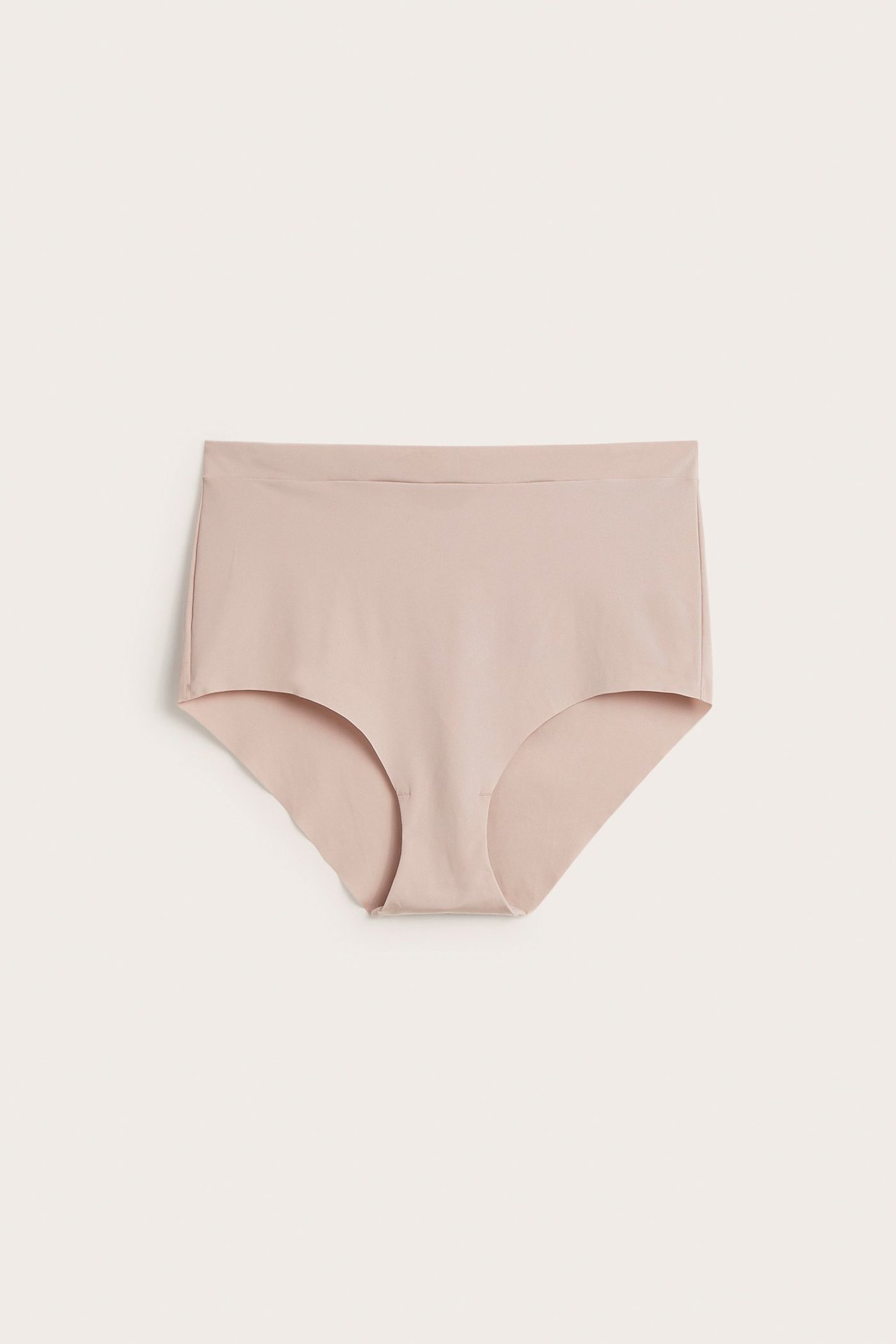 Frontvisning av lys rosa sømløs mikro hipster truse med bred linning.