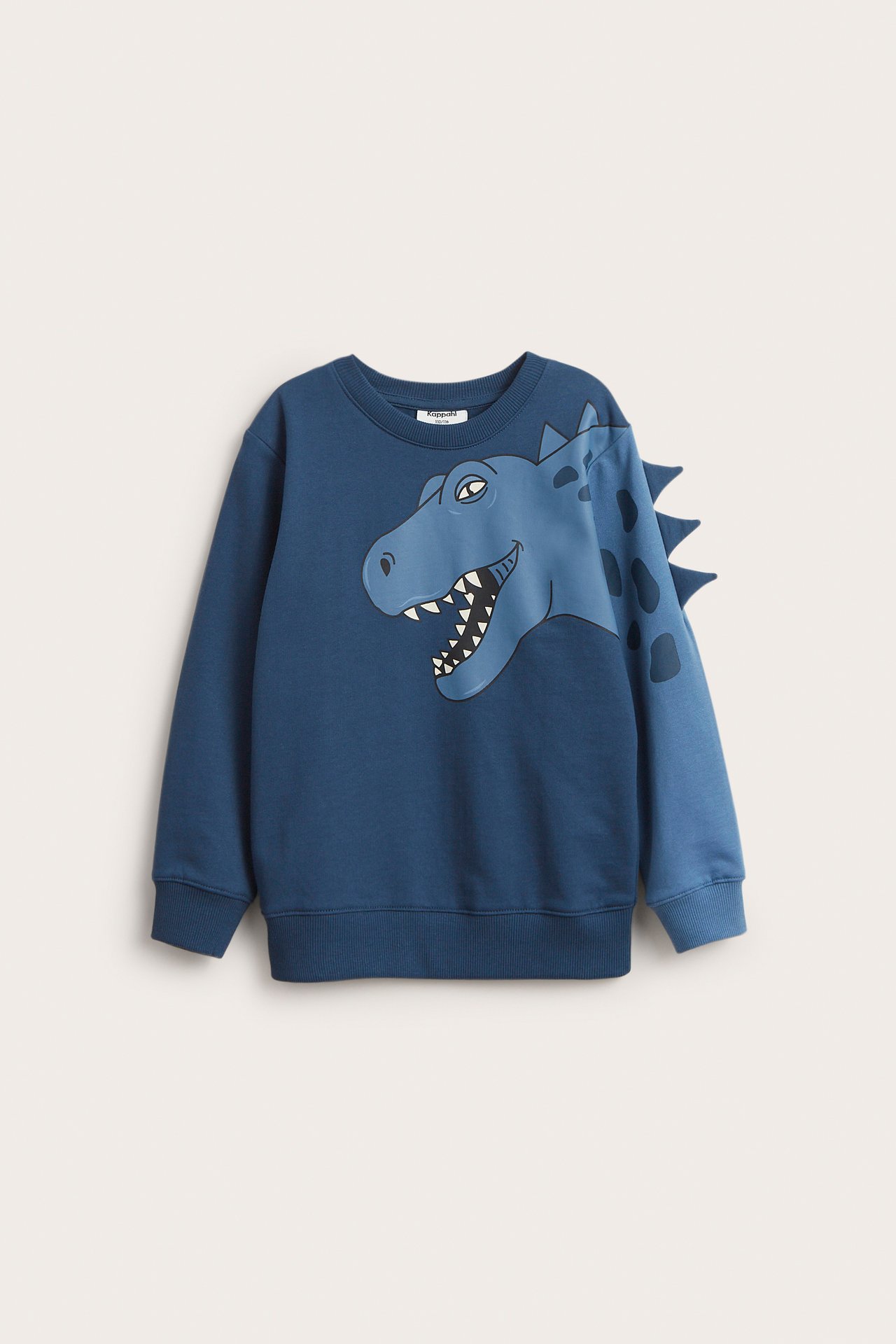 Edestä, lasten tummansininen puuvillapusero dinosauruskuviolla ja 3D-piikeillä hihassa.