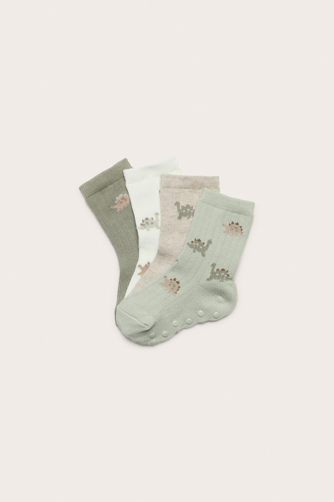 Fyra par babysockor: mintgröna, beige, benvita, olivgröna, med dinosauriemönster och antislip.