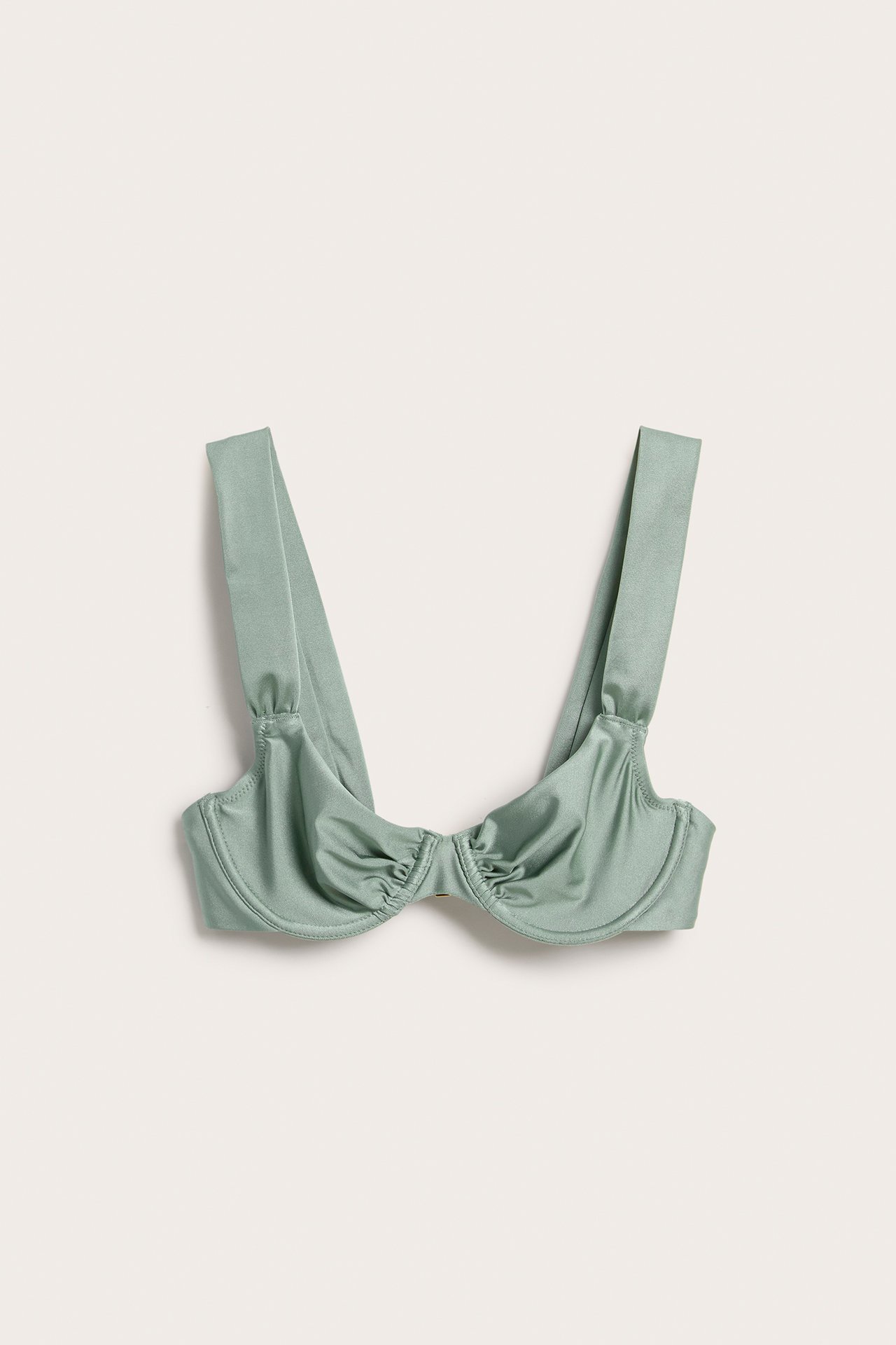 Framifrån, ljusgrön bygel-bikini-bh med draperade kupor och breda axelband.