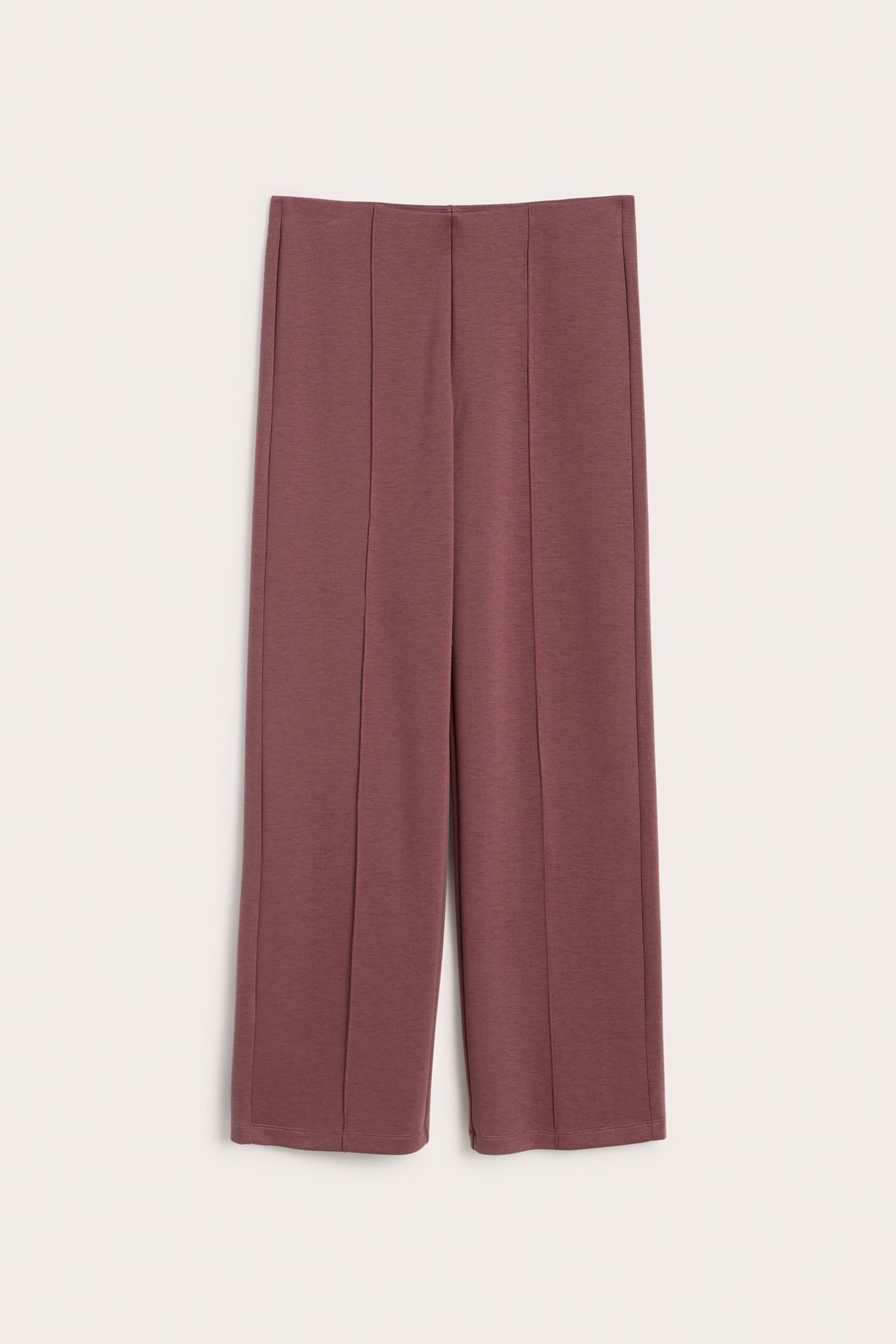 Frontvisning: Mørkerøde vide jerseybukser med sydde sømmer foran.