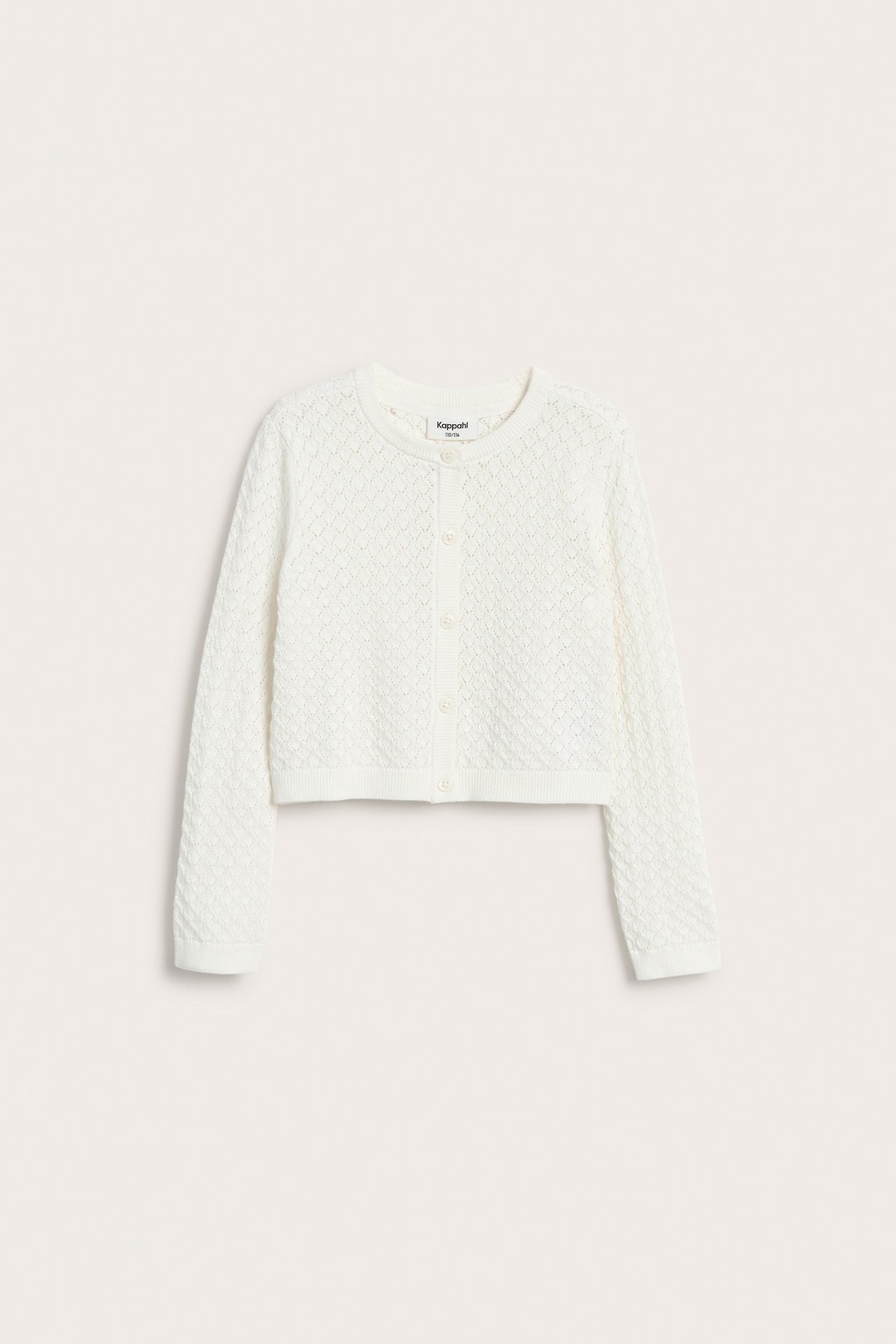 Frontvisning av en offwhite barnecardigan med rund hals, hullmønster og knappelukking.