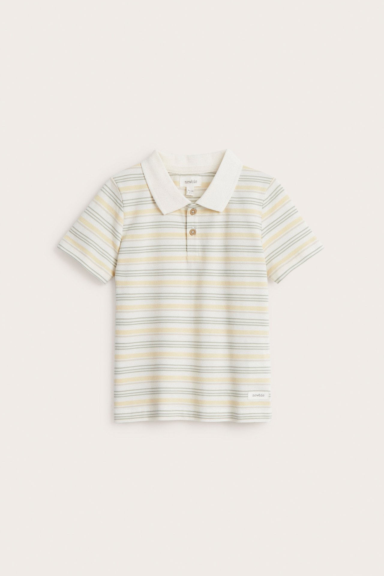 Frontvisning: Barns offwhite stripete bomulls-pologenser med krage og tre brune knapper.