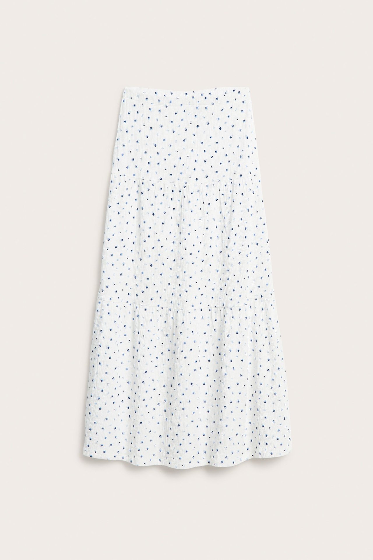 Frontvisning: hvitt krøllet jersey maxiskjørt med lite blått blomstermønster og lagdelt design.
