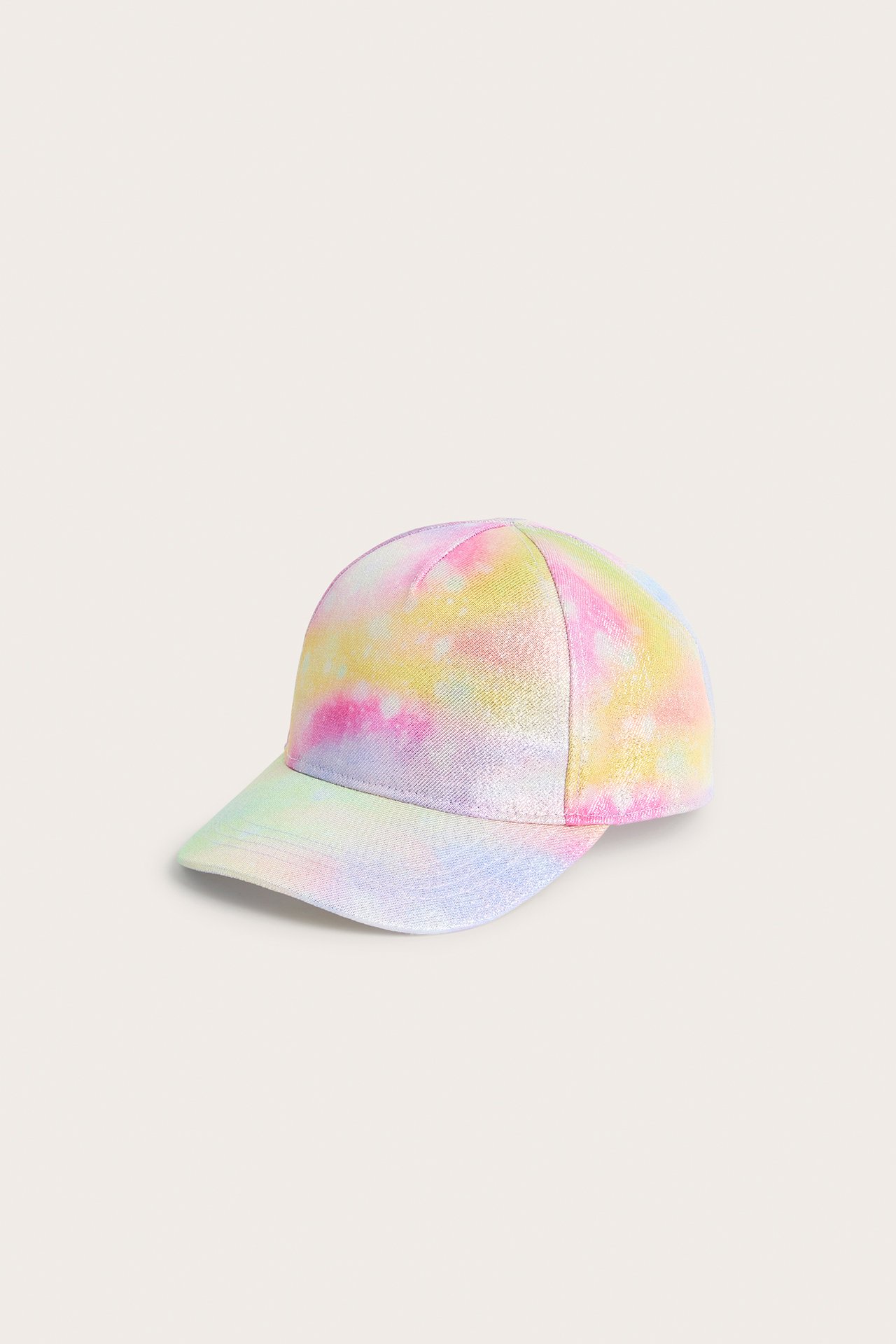 Framsida av en glittrig regnbågsfärgad tie-dye keps för barn.