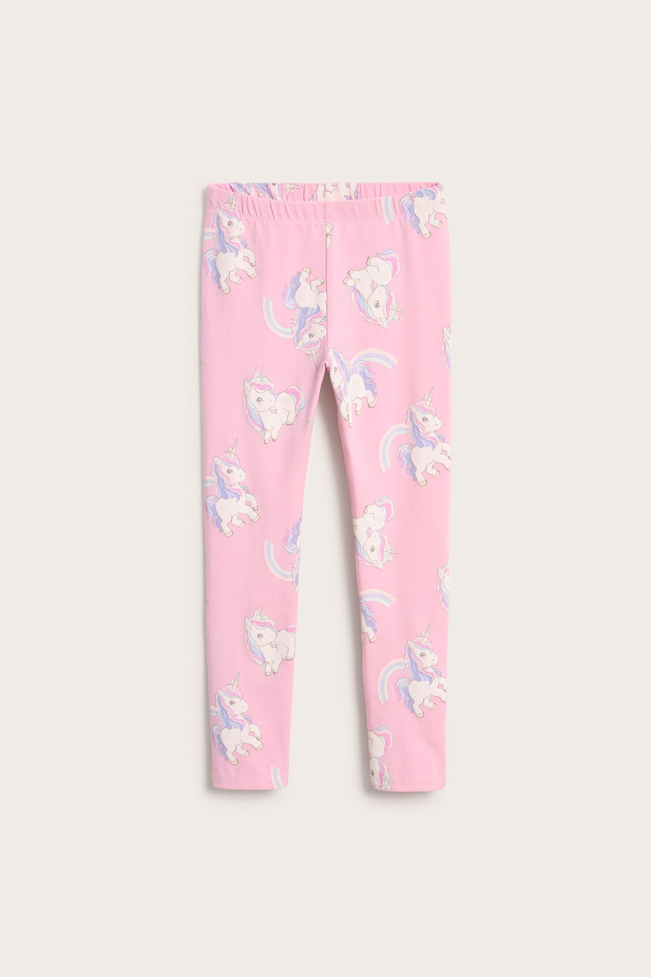 Framifrån, rosa stretchiga barnleggings med färgglatt enhörnings- och regnbågsmönster.