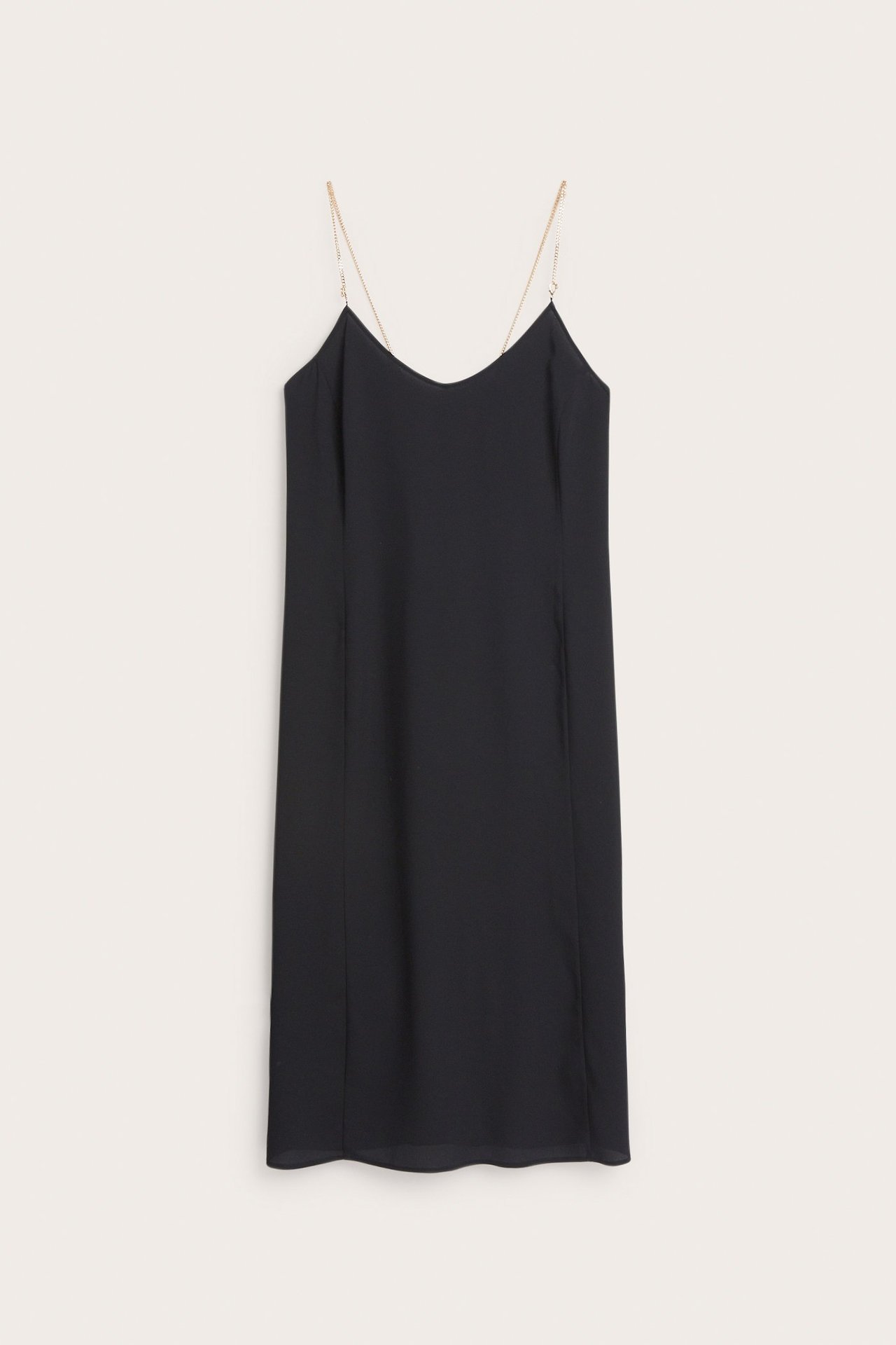 Edestä musta polyesterinen alusmekko kultaisilla ketjuolkaimilla, polvipituinen.