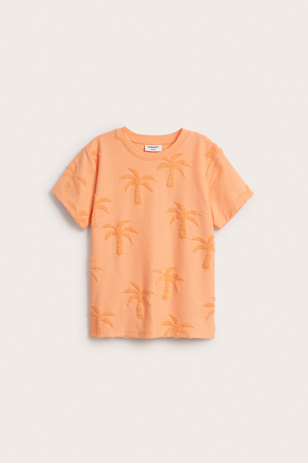 Framifrån: Orange kortärmad t-shirt för barn med palmmönster i frotté.