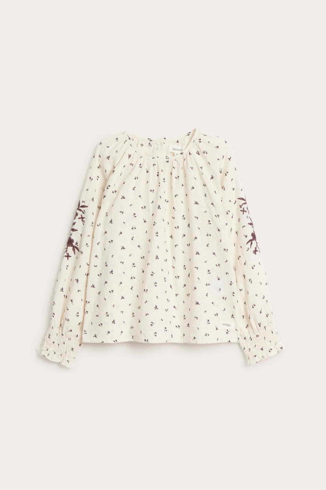 Småblomstrete vevd bluse
