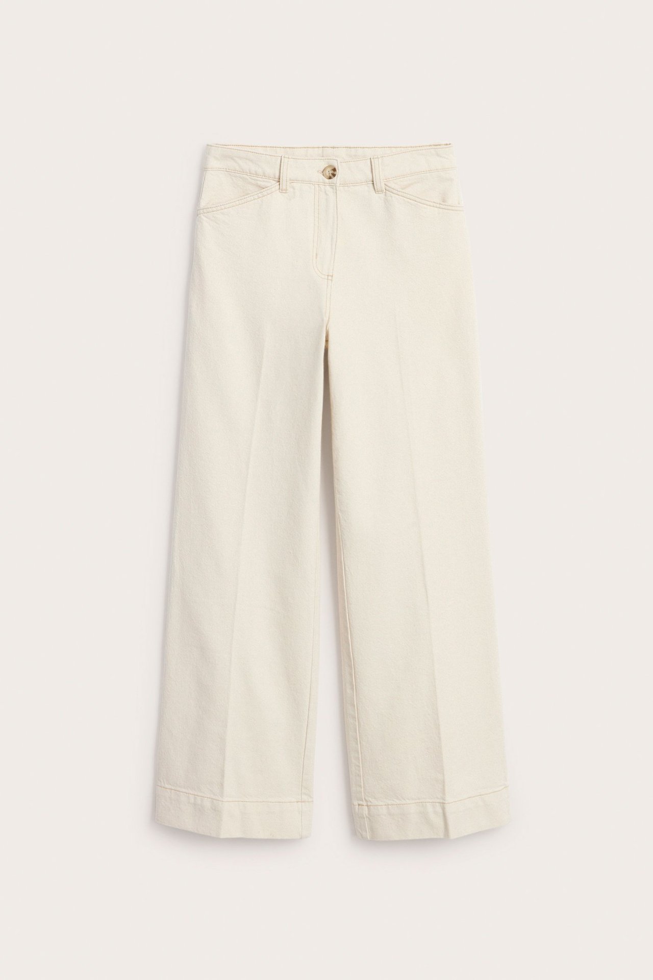 Frontbilde av beige vide twillbukser med én knapp og kontrastsømmer.