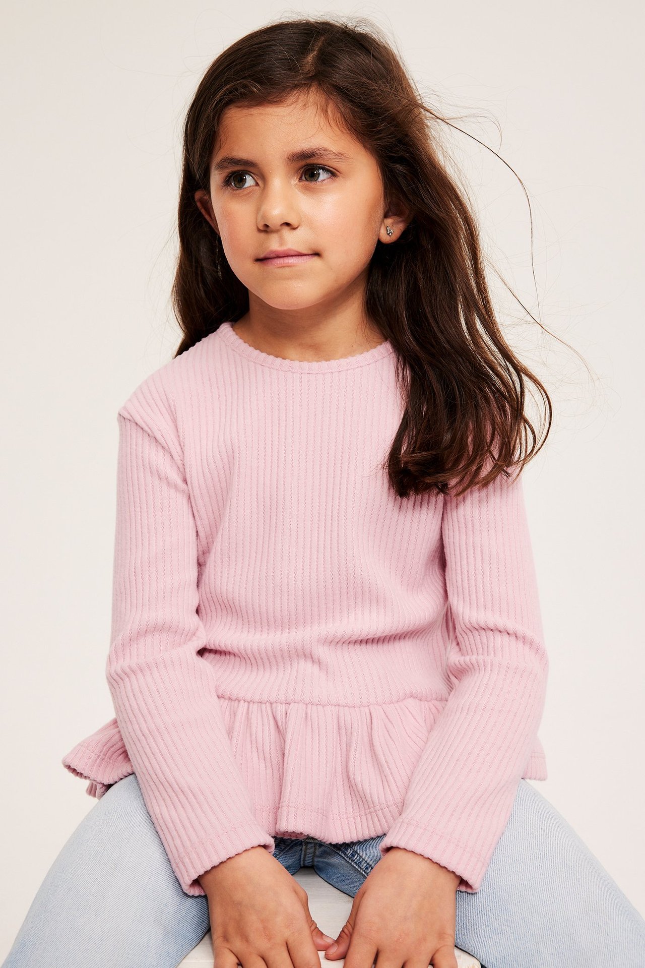 Långärmad peplumtopp