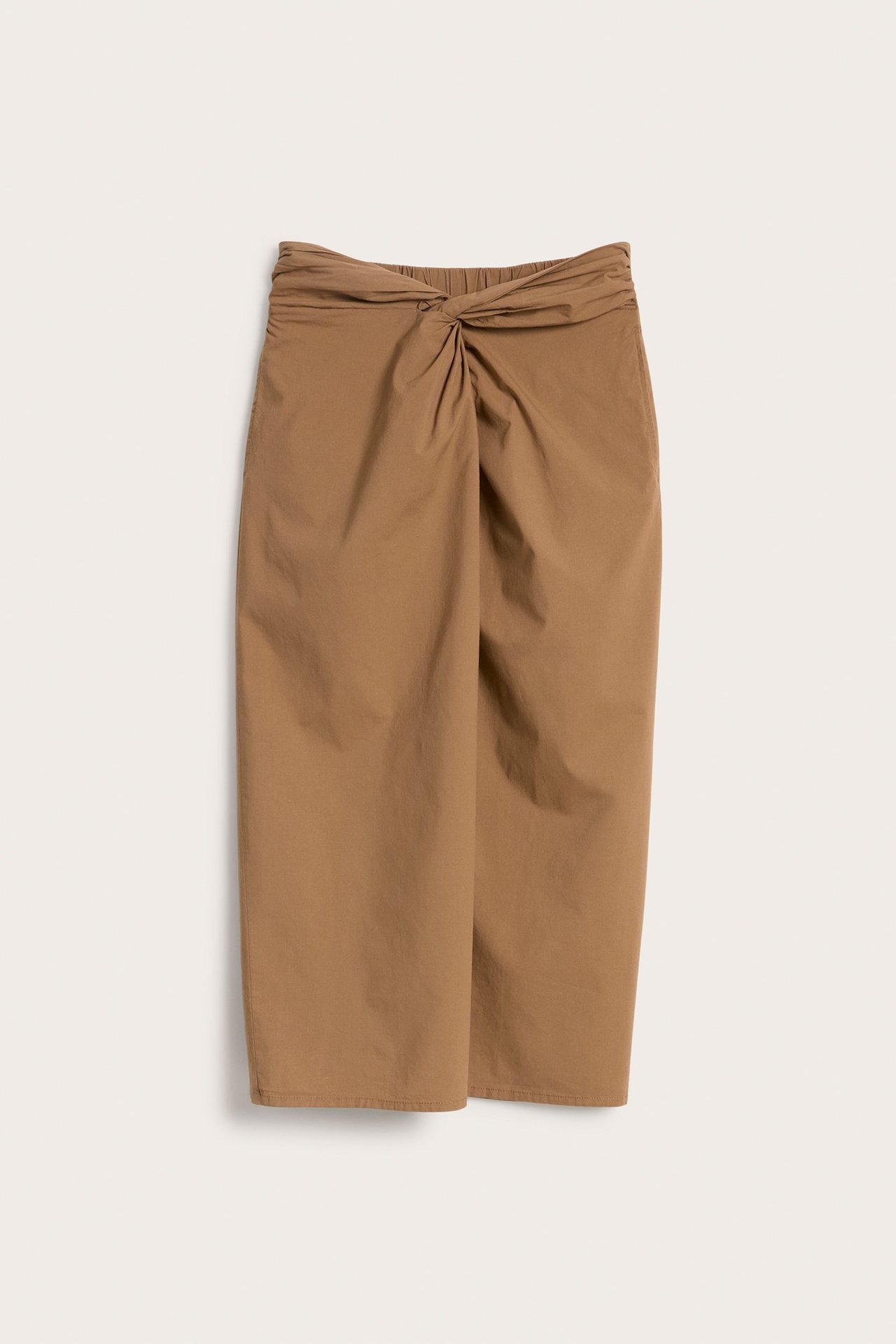 Frontvisning: brunt midi-skjørt i bomull-viskoseblanding med knute- og draperingsdetalj foran, strikk bak.