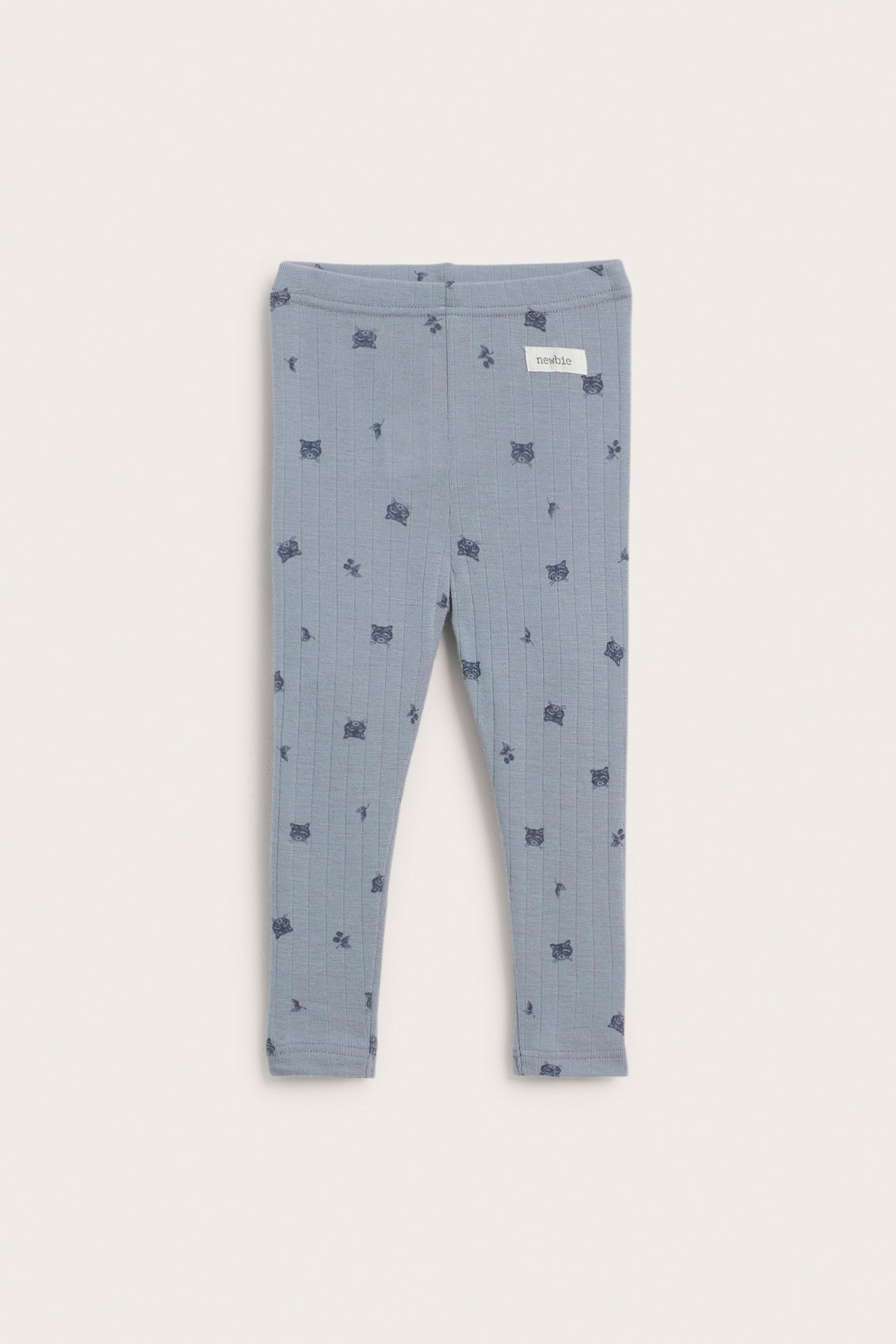 Frontvisning av babyens lyseblå ribbestrikkede merinoullsleggings med mørkt dyremønster.