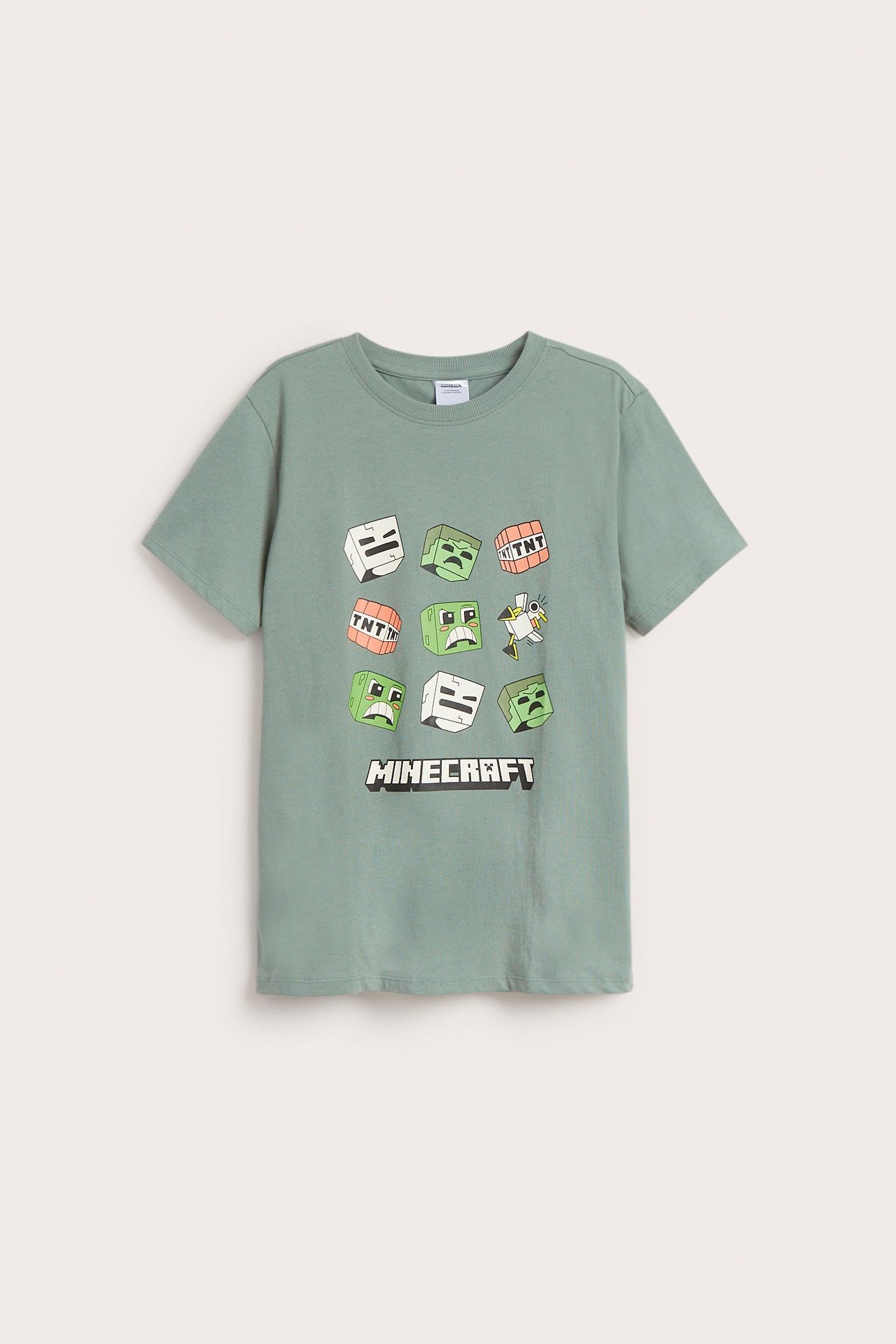 Framifrån: Barns ljusgröna bomulls-t-shirt med Minecraft-blocktryck.