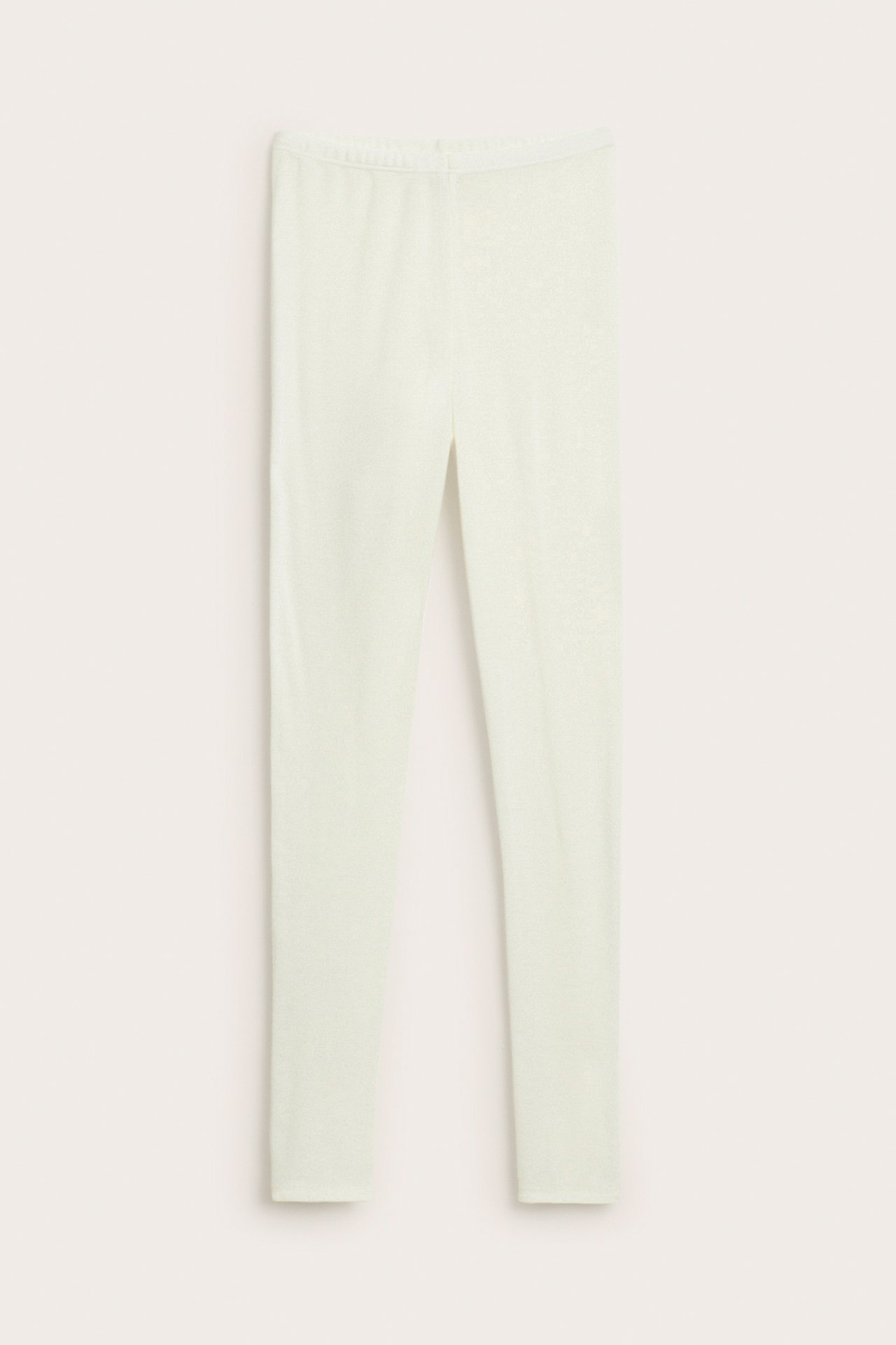 Edestä, vaaleanvihreät kimaltelevat täyspitkät leggingsit.