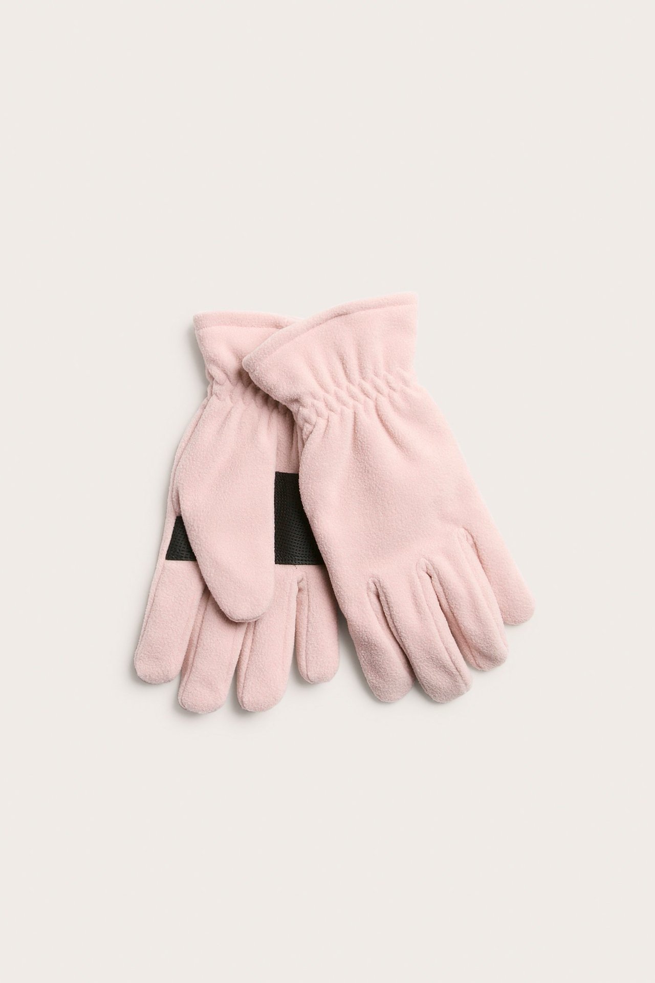 Ylhäältä kuvatut vaaleanpunaiset fleecehanskat, joissa joustavat ranteet ja mustat PU-kämmenotteet.