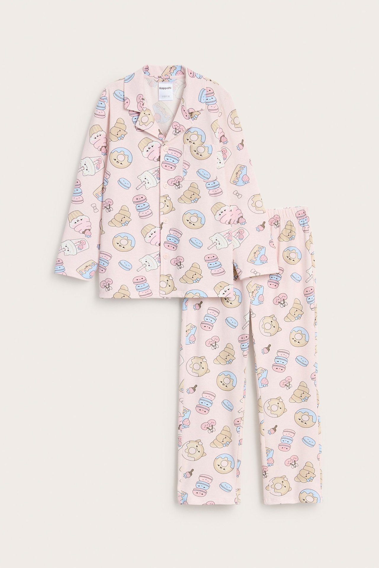 Edestä näkymä lasten vaaleanpunaisesta jersey-pyjamasetistä, jossa on värikäs jälkiruokakuvio.