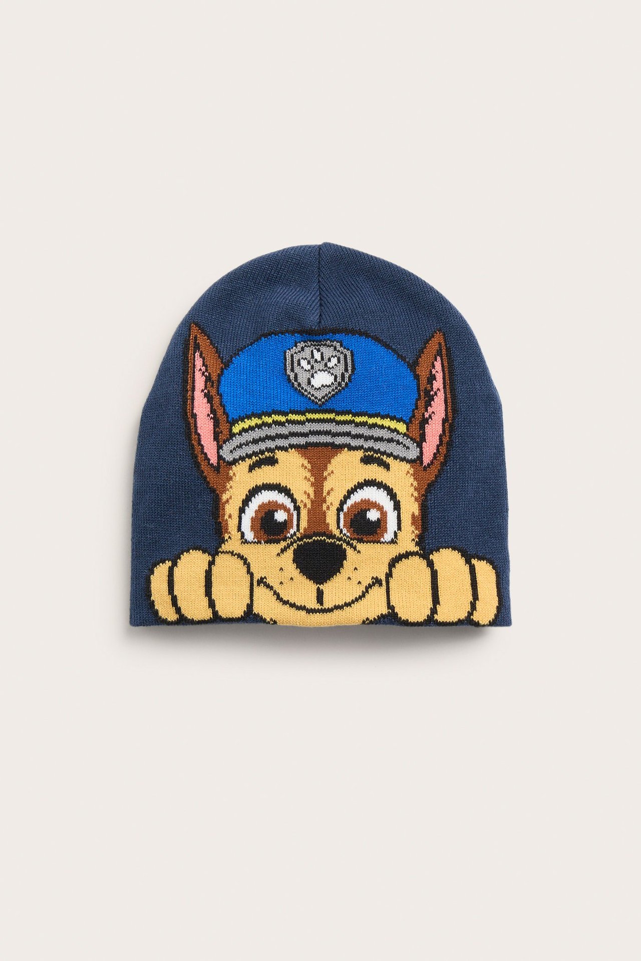 Edestä näkymä tummansinisestä jacquard-neulotusta lasten piposta, jossa on Ryhmä Hau Chase -kuvio.