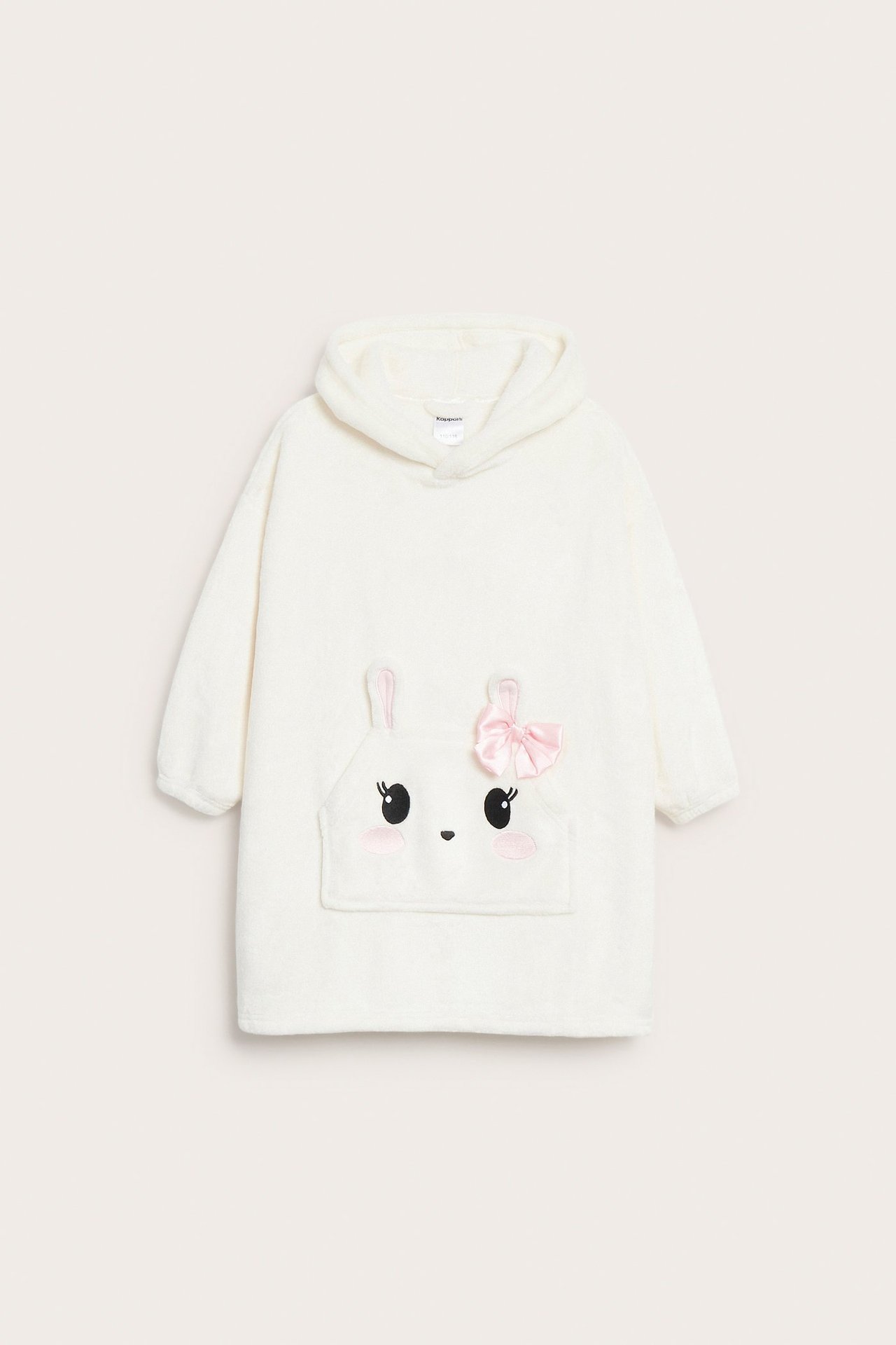 Widok z przodu: Kremowy dziecięcy szlafrok polarowy z kapturem, kieszenią z królikiem i różową kokardą.