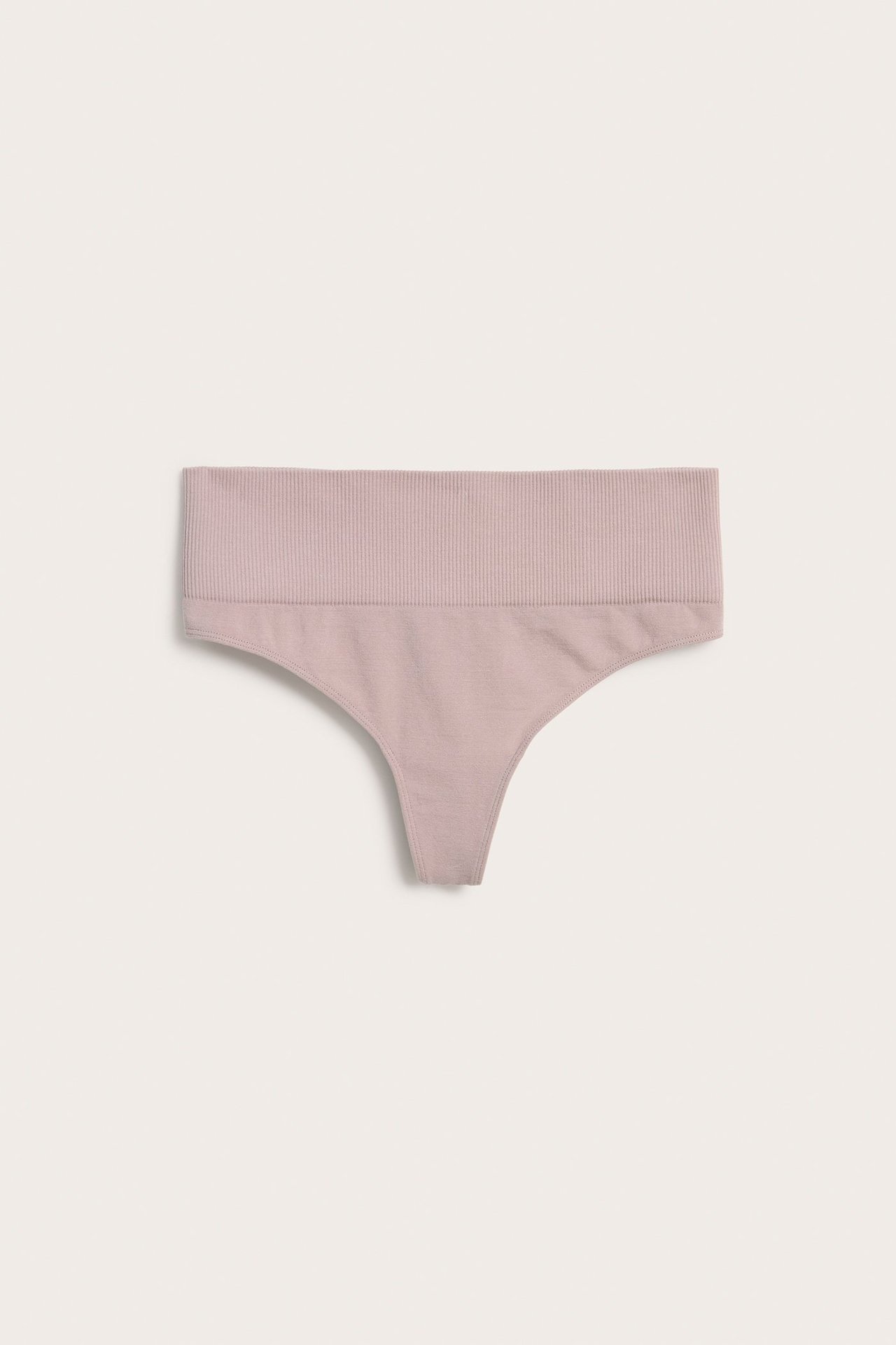 Forfra, rosa sømløs stringtruse med ribbet midjehøy linning.