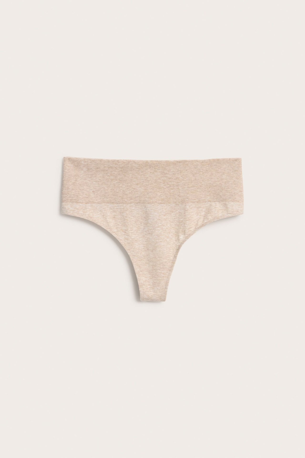 Forfra, sømløs melert beige stringtruse med midi-høyde og ribbet midje.