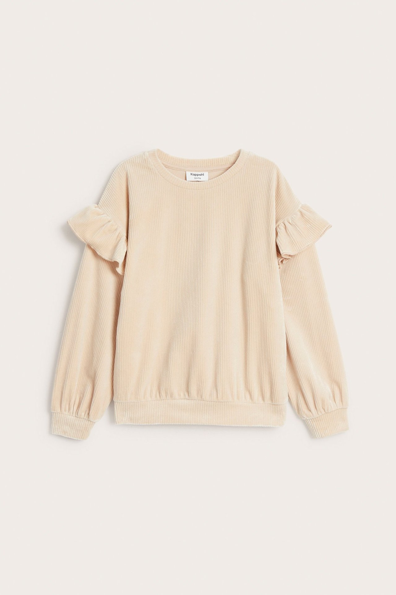 Widok z przodu beżowej, prążkowanej welurowej bluzy dziecięcej z falbankami na ramionach i ściągaczami.