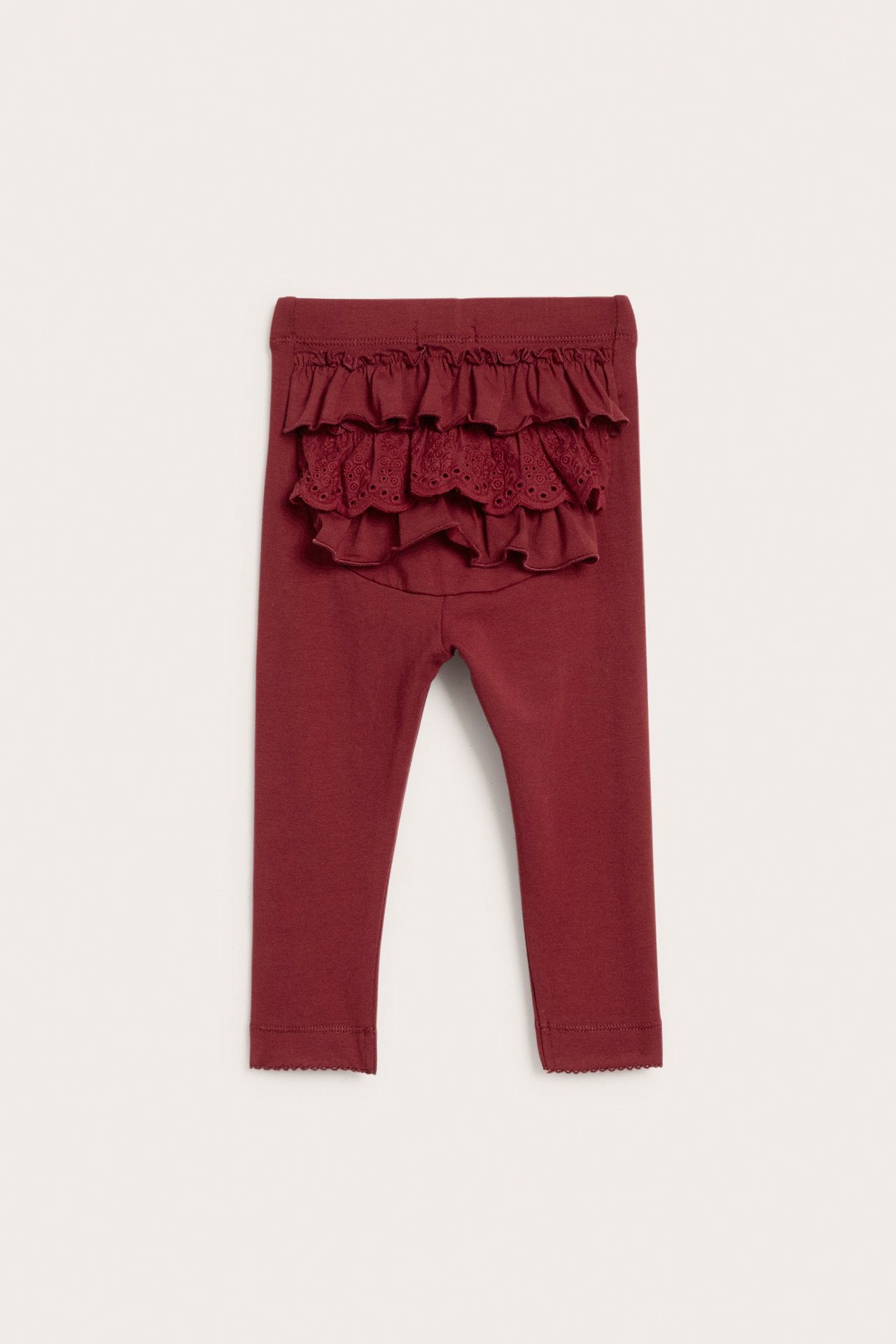 Bakside: Røde baby-leggings i bomullsblanding med elastisk midje og blondevolanger.