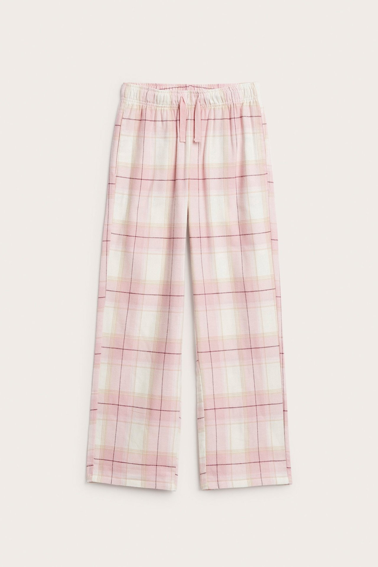 Framifrån: Ljusrosa och vitrutiga flanellpyjamasbyxor med resår och dragsko i midjan.