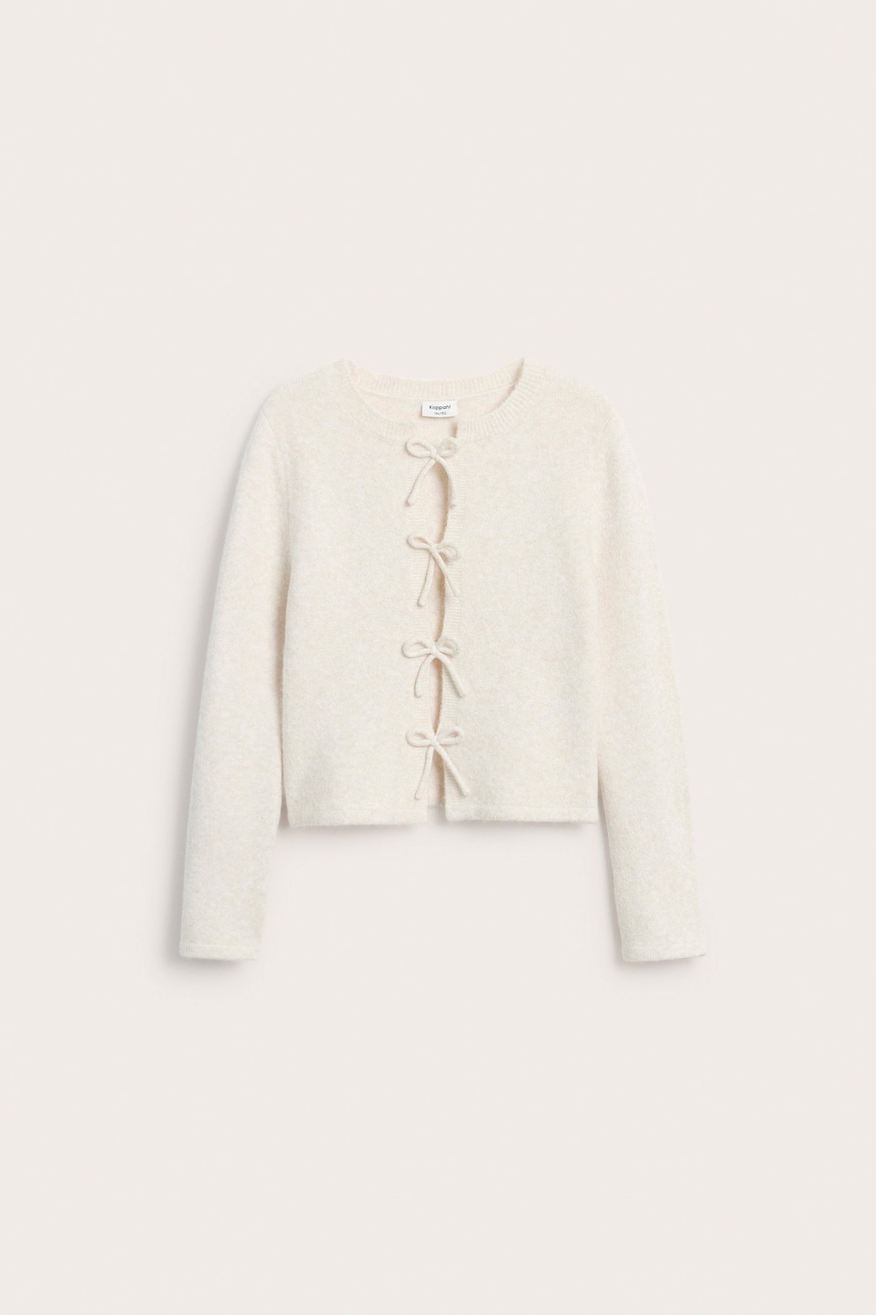 Stickad tröja med rosetter